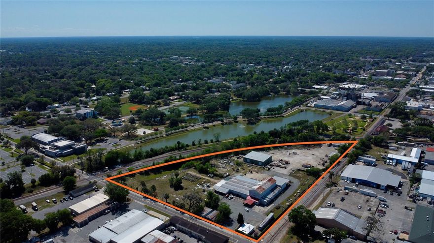 7.65 commercial acres located next to Ocala's beautiful Tuscawilla Park and the City's Performing Arts Theater.  Seldom does a property of this size become available for purchase in the downtown Ocala area.  Total tax and square footage has been calculated for both parcels and all buildings combined. The property features five buildings:  16,047sf warehouse (1945), 5,950sf warehouse (2013), 2,216sf warehouse (1959), 1,056sf office (1955) and a 600sf office (1945).  The current zoning is M-2 (Medium Industrial) with Low Intensity Land Use.  CSX rail borders the property's eastern boundary. 

From the mid 1980's until several years ago, the property operated as "Svinga Brothers",  a scrap-metal and recycling operation.  

Current deed restrictions provide for industrial purposes only on the southern 3.12 acre parcel (26104-000-00).  This entire parcel is sealed and covered with an 8" concrete pad as a result of the parcel's use from 1890's and 1950's as a manufactured gas plant, which deposited coal tar sludge into an onsite pit on the southern parcel.  Environmental history and contacts are available.  

The property is located within the City of Ocala's North Magnolia CRA (Community Redevelopment Area) and is eligible for significant tax incentive and improvement funds.  

Highlights:
Five Buildings (25,869sf Total)
Historic Ocala 7.65 Commercial Acres
Overlooking Beautiful Tuscawilla Park and Performing Arts Theater
7.65 Acres
Industrial Zoning