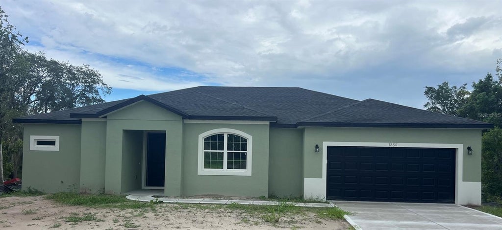 Photo of 1355 W Hartley Circle, Deltona, FL 32725 (MLS # O6443505)