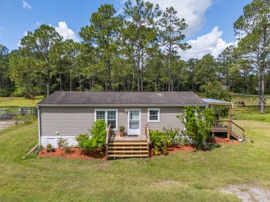 Mini Farm for Sale | 3-Bedroom 2-Bath Doublewide on 3 Lots with Pasture in Flagler County
Discover the perfect blend of country living and convenience with this mini farm on three cleared lots (465’x300’ total), fully fenced and ready for your animals. The property features a pasture, horse stalls, and a workshop, making it ideal for horses, livestock, or hobby farming. With multiple lots, this property also offers the potential for a family compound or additional homesites.
The 3-bedroom, 2-bath doublewide manufactured home boasts an open floor plan, a bright eat-in kitchen, spacious living areas, a welcoming front porch, and a side covered deck perfect for relaxing or entertaining.
Conveniently located just minutes from Bull Creek (also known as Dead Lake)—a popular spot for boating and freshwater fishing—and less than 45 minutes to Flagler Beach. You’ll also be close to Palm Coast, Interstate I-95, shopping, schools, and a hospital, making this the ideal blend of country charm and modern convenience.
This property is perfect for anyone seeking a mini farm, horse property, or country home in Flagler County