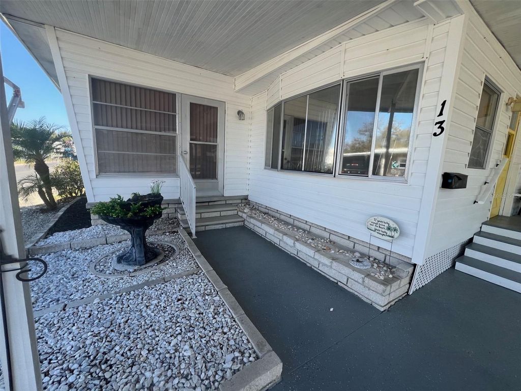 Photo of 13 Pindo Palm Street E, Largo, FL 33770 (MLS # TB8501999)