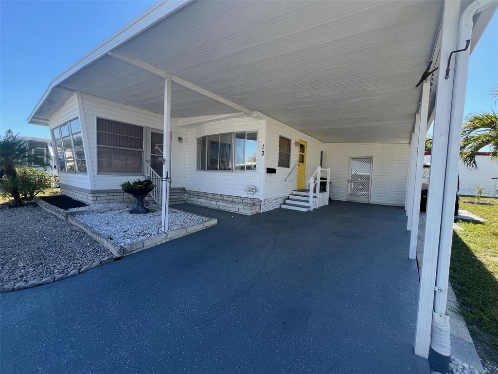 Photo of 13 Pindo Palm Street E, Largo, FL 33770 (MLS # TB8501999)