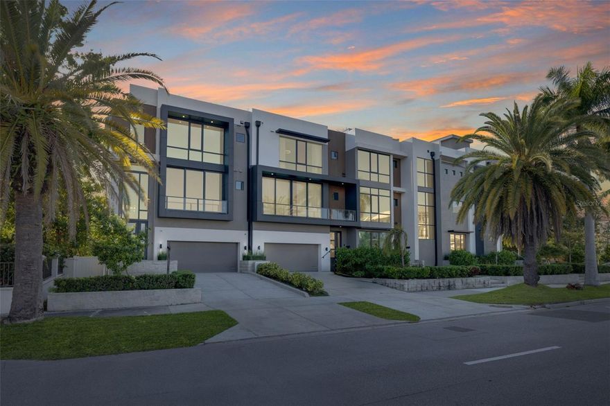 Short Sale. Third-Party Approval Required. Welcome to 98 W Davis Blvd, an exquisite luxury townhouse nestled in the heart of prestigious Davis Islands in Tampa, Florida. Built in 2022, this exceptional residence exemplifies modern sophistication and convenience, serving as the final masterpiece of acclaimed designer Tommy Lamb. From its meticulously curated details to its thoughtfully designed layout, every element of this home reflects the pinnacle of high-end living. Upon entry, the first floor reveals a versatile bonus room complete with a wet bar—an ideal space for entertaining guests. Adjacent to this is a spacious guest suite featuring an en-suite bathroom with custom built-ins, a dedicated makeup vanity, and direct access for use as a pool bath. The second floor is designed for both elegance and functionality, offering a formal living room with a sleek ventless fireplace, a sophisticated dining area, a powder bath, and a chef-inspired kitchen. Outfitted with top-of-the-line Wolf appliances, a Sub-Zero refrigerator, and a stunning waterfall island that comfortably seats four, the kitchen is further enhanced by a striking quartz feature wall, dual pantries, and abundant cabinetry. Nearby, a cozy family room and a glass-enclosed wine room—showcasing the floating staircase—complete the floor. Ascend to the third level where you’ll find another guest suite with a walk-in closet, a dedicated laundry room with dual washer and dryer sets, and a breathtaking master suite. The master retreat features a private balcony, an expansive walk-in closet with sleek black built-ins and gold accents, and a spa-inspired en-suite bathroom. Indulge in the freestanding black soaking tub, oversized shower with multiple heads, and dual vanities designed for both function and flair. For added ease, an elevator services all levels of the home. The two-car garage offers generous space, including room for a golf cart. Retreat to your own private rooftop where you can soak up the beautiful Florida sunsets and enjoy water views perfect for both intimate relaxation and vibrant entertaining. Located on the coveted Davis Islands, this property provides not only a refined lifestyle but also a family-friendly environment. Residents enjoy access to top-rated A+ schools and a vibrant, picturesque community just moments from downtown Tampa. Don’t miss the rare opportunity to own this extraordinary residence. Contact us today to schedule a private tour and experience luxury redefined at 98 W Davis Blvd. Bring an offer!!