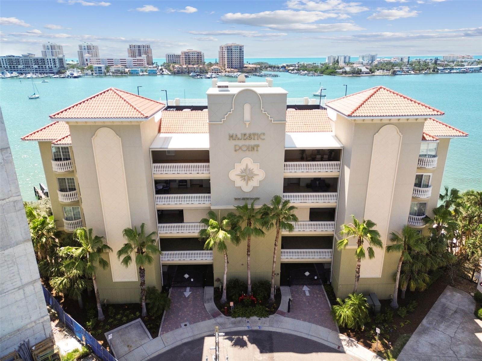 Experience Luxury Waterfront Living at The Majestic Point.
Welcome to one of Island Estates’ most exclusive boutique residences, with just 14 luxury condos. This fully furniture stunning home offers breathtaking, unobstructed views of open water and nightly sunsets from the living room, kitchen, and primary suite. Watch sailboats and cruisers drift by from your expansive, covered balcony — the perfect spot to unwind, rain or shine.
Inside, the open-concept layout enhances the home’s spaciousness and flow. The chef’s kitchen features stainless steel appliances, granite countertops, custom cabinetry, and an oversized island with bar seating — ideal for entertaining. The split-bedroom floor plan ensures privacy, with a luxurious primary suite that includes private balcony access, his-and-her custom closets, dual vanities, and a walk-in shower.
Additional upscale touches include custom electric-automatic blinds and shades with smartphone and voice commands, tray ceilings with crown molding and ambient lighting, and a luxury equipped-Bar. The laundry room equipped with new washer and dryer machines.
Residents enjoy premium amenities: a resort-style pool with heated spa, outdoor grilling and dining areas, secure storage, and gated under-building parking.
Situated less than a mile from the award-winning Clearwater Beach, Island Estates offers a self-contained lifestyle with a Publix, fine dining, and the Clearwater Aquarium. Just over the bridge, you'll find PGA golf courses, top-rated hospitals, and all the conveniences of the mainland.
With its refined design, boutique exclusivity, and unbeatable location, this property presents a rare opportunity to live the ultimate waterfront lifestyle.
