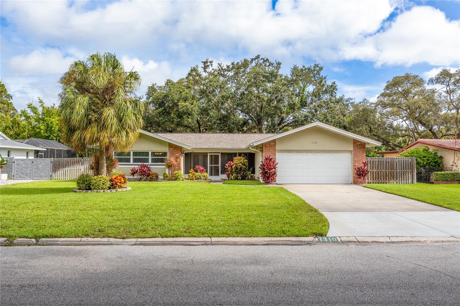 Put this at the top of your list to tour! Inventory remains tight in Fairway Estates, so don’t miss your chance on this one! This spacious 3-bedroom, 2-bathroom home features a desirable split-bedroom floor plan and an open-concept kitchen.
The living space is incredibly versatile and offers endless possibilities. Currently staged to showcase a large formal living and dining room, the area connected to the kitchen is set up as a cozy family room. Beyond that, you’ll find a wet bar/game room area complete with a generous reading nook—perfect for relaxing or entertaining.
All three bedrooms are generously sized. The primary suite includes a large, updated ensuite bathroom and a walk-in closet. The two secondary bedrooms are located on the opposite side of the home, each with ample closet space and convenient access to the fully updated guest bathroom.
At the front of the home, a lovely covered and screened-in porch offers a warm welcome. In the back, a cozy deck invites you to unwind while enjoying the lush landscaping and fully fenced yard. The west side of the property is wide enough to accommodate a boat or trailer behind the fence.
Major updates provide peace of mind: Roof and HVAC were replaced in 2016, windows were updated in 2015, and sliding glass doors were upgraded in 2018.
Fairway Estates is ideally situated along the newly restored Dunedin Golf Club—revitalized to its historic Donald Ross design standards. Whether you're a golfer or simply appreciate the scenic beauty, this course is a local gem. Just a short walk or bike ride brings you to the Pinellas Trail, and a few miles more puts you at the entrance to the award-winning Honeymoon Island and Caladesi Island State Parks.
This is a golf cart-approved area, making it easy to access all that Dunedin has to offer—including downtown, with its vibrant collection of shops, restaurants, bars, and breweries.
There’s so much to love about living in Fairway Estates and delightful Dunedin!