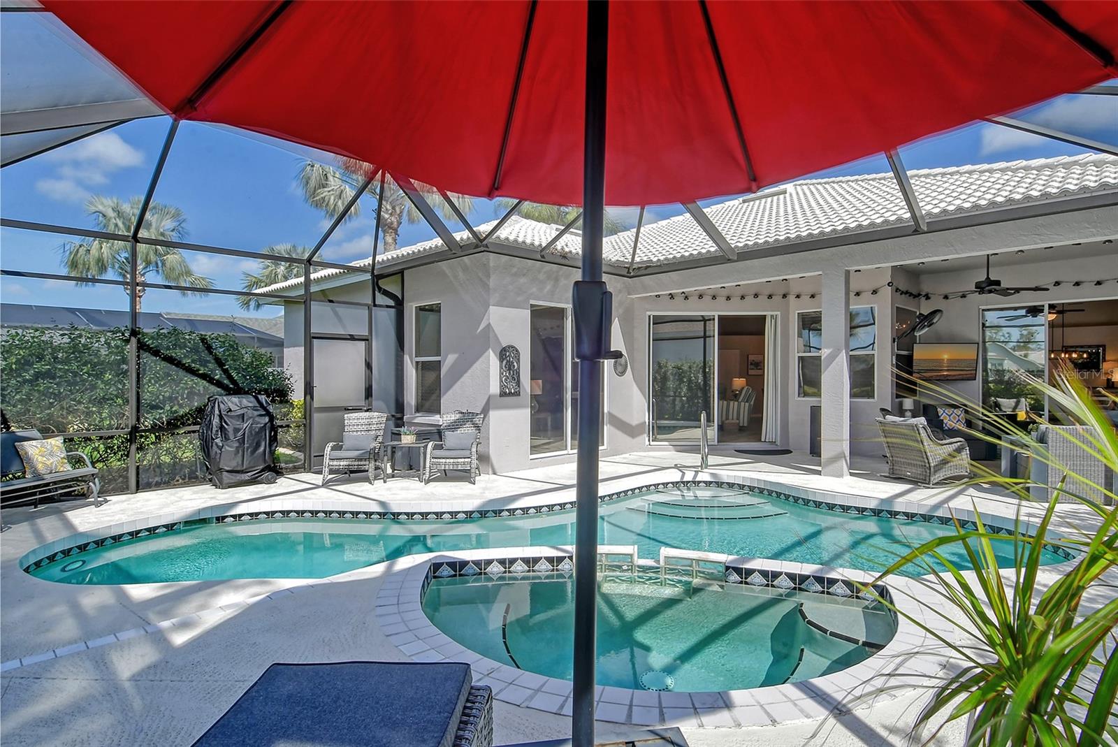 Tara Golf & Country Club. New listing now available for March/April 2025 and Season 2026 at $7,500/month with a 3-month minimum, with Full Golf & Social Membership Transfer. Also available for short term off-season rental 2025 at $4,000/month, or 6+ months. This beautifully updated 3 bedroom, 3 bath pool home, is Located on the golf course, it has a fabulous split open floor plan with a living room/dining room combination and sliding glass doors leading out to the lanai/pool area, spacious combined family room, and kitchen with quartz counters, stainless steel appliances, breakfast bar that seats 4 plus, and an additional breakfast seating area. Leading from the family room you will find the large master bedroom with a king-size bed, walk-in closet, sliders which open onto the pool area, en-suite bath with walk-in shower and separate jacuzzi tub, + 2 separate vanity sinks. The separate guest quarters, both with queen beds, and each has its own bathroom, one with tub/shower and one with walk-in shower. Step outside from the living room sliding glass doors to your private oasis, a covered relaxing seating area with mounted tv, grill, and ceiling fan, leading to the heated sparkling pool and spa, surrounded by lush landscaping. Relax and enjoy this tranquil oasis, with views of the golf course (12th hole) while soaking up the warm Florida sun! The home comes with Full Golf & Social membership to Tara Golf and Country Club where you can enjoy all the amenities, Golf, Tennis, Pickle Ball, Full Fitness Center, Bocce Ball courts, and an active Clubhouse that has daily events, fine dining and a grill room, a pro-shop, driving range, putting green and firepit, and so much more! This community is centrally located with easy access to I-75, shopping, dining, and a short drive to Sarasota/Bradenton International Airport, UTC Mall, the Ringling Museum, downtown Sarasota, and some of the most beautiful beaches in Southwestern Florida, including the world-renowned Siesta Key Beach with its crystal quartz powdery sand and turquoise blue waters of the Gulf of Mexico! Sorry, no pets allowed.