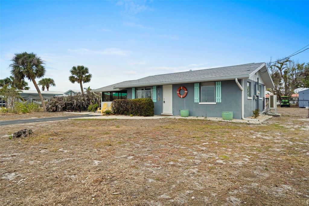 Photo of 1956 Massachusetts Avenue, Englewood, FL 34224 (MLS # A4664648)