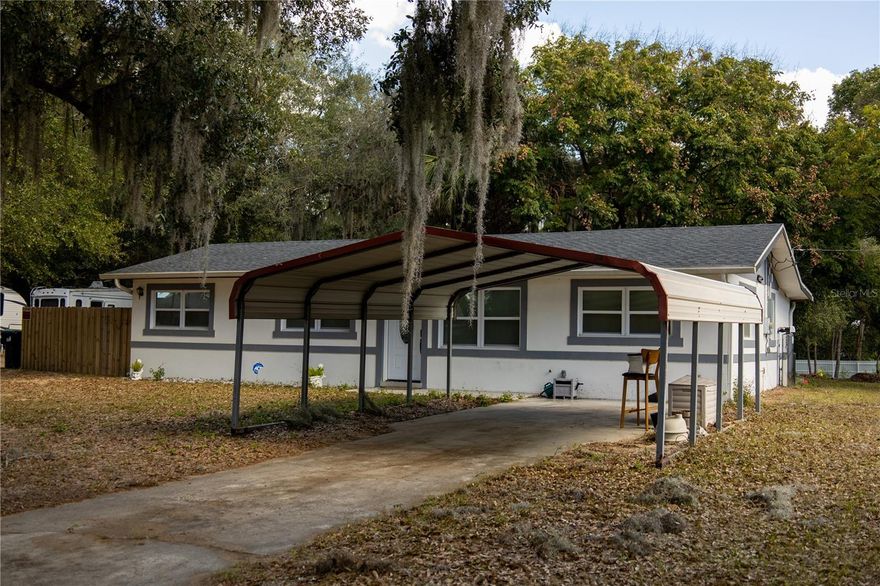 Welcome to your new and improved home that sits on over 1 acre lot in the heart of Apopka! As you walk in the front doors the first thing you notice is the new marble flooring that has been put throughout the entire house along with updated recessed lighting. The kitchen has beautiful quartz countertops and stainless steel appliances equipped with a breakfast bar. Your new home has a split floor plan with a generous sized master bedroom on one side including a gorgeous updated vanity with a led lighted mirror and step in shower. On the other side of the home you will find the remaining 1 bedroom that are quite spacious and additional bathroom and kitchen that has also been renovated. Off of the kitchen there is an indoor laundry area and a tankless water heater that was installed in 2021. The roof was replaced in 2022. Step out to the backyard and see the enchanting trees that provide ample amount of shade. The possibilities are endless with the amount of land you have and yet you are minutes to schools, churches, shopping and dining. Easy access to major highways. Schedule your showing today to see it for yourself!