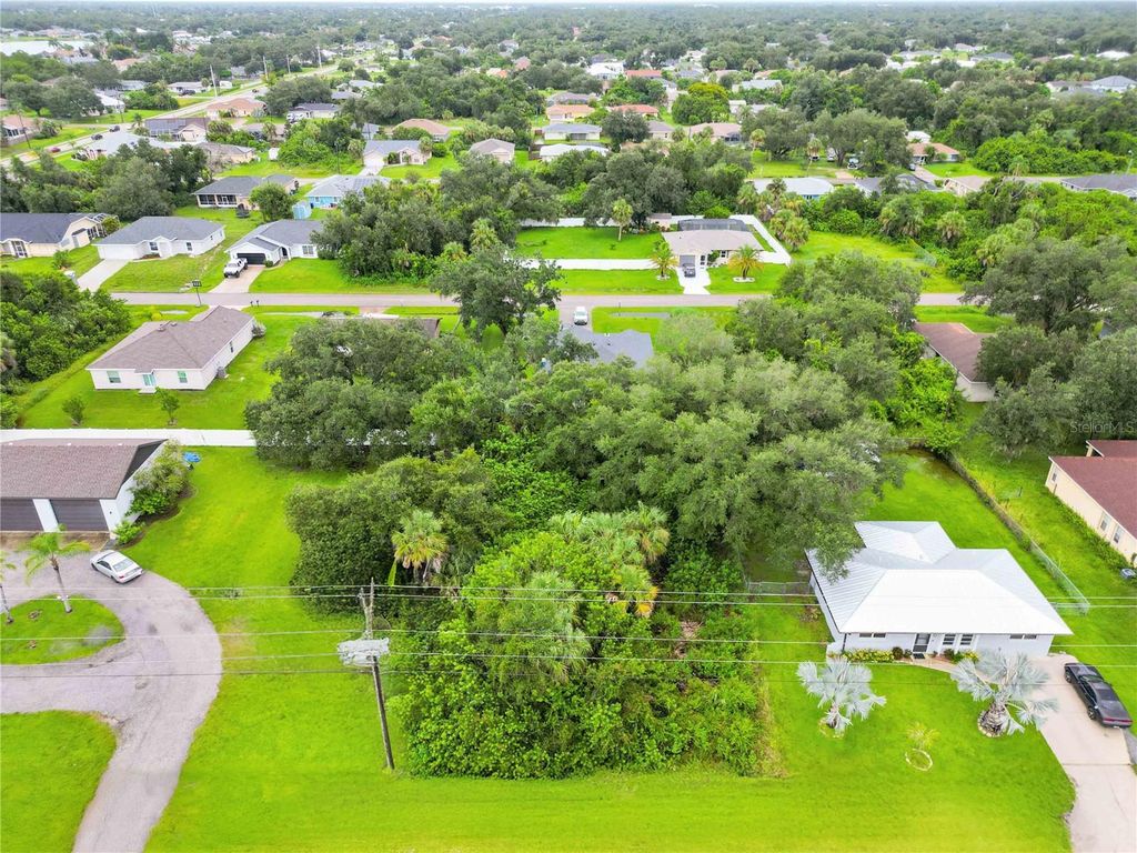 Photo of 1050 Birchcrest Boulevard, Port Charlotte, FL 33952 (MLS # O6339436)