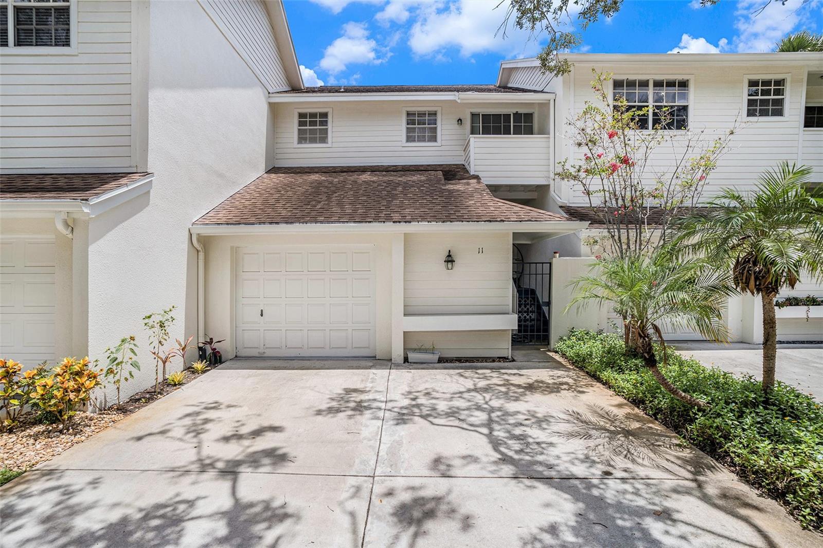 Lovely townhome nestled at the end of a private drive with a pond and fountain view in highly coveted Ballast Point. There are 3 balconies to enjoy all the wonderful Tampa sun and warm weather one from the 1st floor living area, one from the master bedroom, and a small one from the 2nd bedroom. Updated kitchen with granite, wood floors, stainless appliances, and breakfast bar. The split level floor plan allows for an open feel with views of the pond and fountain from the entire living area. There is a large great room with a fireplace that splits between the living room and dining area. There is also a dry bar with wine cooler tucked under the stairs to make entertaining easy from the living room and large balcony. The 2 bedrooms upstairs have ensuite baths, private balconies, and there is a walk-in closet in the owners suite. Other amenities are laundry room on the 2nd floor, large one car garage with extra storage, and community pool. Only ½ mile to Ballast Point Park with a dock, 2 miles to MacDill AFB, and 5 miles to Downtown Tampa.