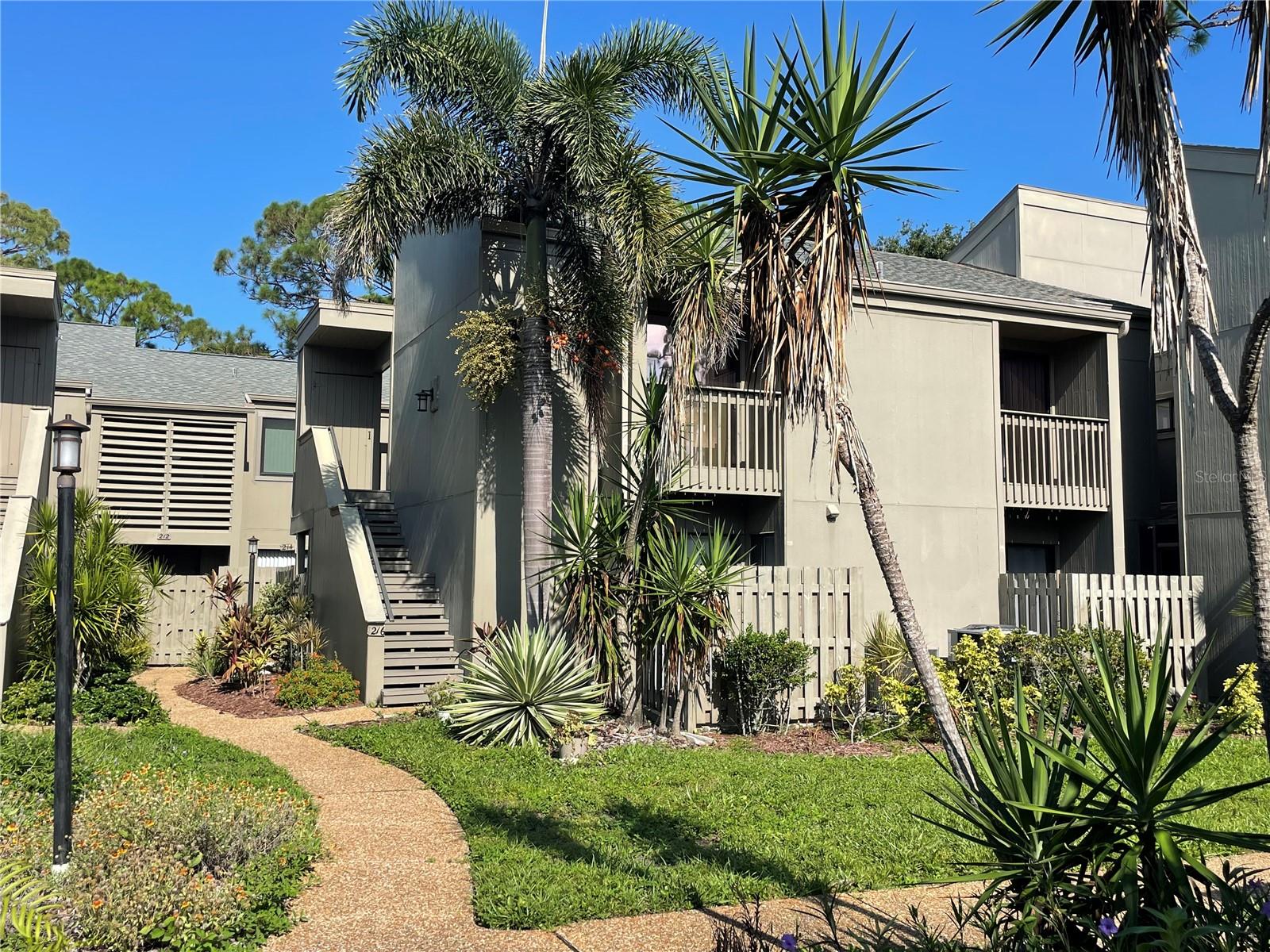 Looking for an active lifestyle community within walking distance of the Intercoastal? Pine Run is the perfect location! Conveniently located between Sarasota and Venice in Osprey, this community is within walking distance of the famed Casey Key Fish House and Tiki Bar, plus many other restaurants, shopping areas, public boat launch, park and so much more! The Legacy Trail is also nearby! Pine Run offers two swimming pools, a small club house with fitness room, pickle ball and tennis courts, all in a wooded setting. This 2nd floor condo has been updated with a new kitchen with quartz counter tops and new stainless steel appliances. The A/C is brand new in 2025! Each of the two bedrooms have their own private balcony. The master suite with full bath, plus two closets! The living room and dining room feature sliding glass doors that lead to the screened balcony. The laundry closet is located in the kitchen and dinette area with washer and dryer included. There is a carport with one designated parking spot. Two exterior storage units
