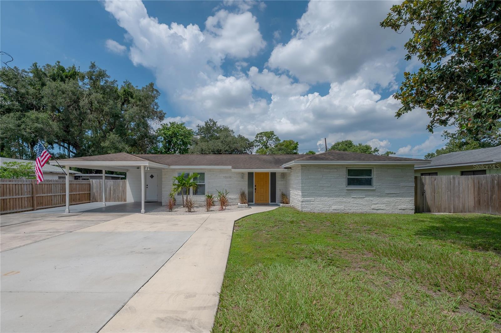Fabulous renovated low maintenance concrete block pool home in sought after Forest Hills! This beauty gives a nod to a mid century style with its fetching dimensional brick exterior walls and front entry. Step inside to discover a BIG OPEN FLOORPLAN with luxury vinyl plank flooring throughout. The kitchen features a large eat in island and offers up gorgeous white quartz counters. You will entertain your guests with style and ease! While the finishing touches of your rosemary pot roast scents the air, you can catch up with everyone from the island bar overlooking all of the action. The master bedroom is spacious with an en suite bathroom. Enjoy your morning cup of Joe in your light filled sun room overlooking YOUR SPARKLING POOL! The moment you walk in your front door your eyes are immediately drawn straight through the great room to your SPECTACULAR HUGE POOL and BACKYARD OASIS. The pool is screened so SUPER EASY to keep clean. Beyond the pool is a BIG BACKYARD featuring new Astroturf grass - no watering or mowing needed! Yes, I think your guests will agree that you've make the perfect choice on this stunning home. Check out these updates: Pool enclosure 2025, all new double paned windows and hurricane impact slider to pool, French drain at entry to pool, new insulation, all new ductwork and new HVAC 2024. Note: SF on county appraiser site is incorrect. Seller has recently put an a/c duct into the laundry room which adds an additional 132 SF.