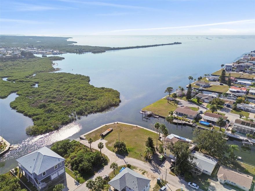 An exceptional opportunity to own one of the largest waterfront building lots in the area, featuring an impressive 176 feet of brand-new concrete seawall as well as a boat ramp that was recently redone—perfectly designed for true waterfront living. This expansive Gulf-front double lot offers remarkable flexibility, allowing you to build your custom Florida dream home!

Enjoy some of the best onshore fishing in the region, right from your own backyard!  Wake up to breathtaking panoramic views of the Gulf of Mexico, unforgettable sunsets, and daily sightings of dolphins and manatees—nature becomes part of your everyday lifestyle.

Nestled in a quiet boating- and golf cart–friendly community at the northern edge of Werner-Boyce Salt Springs State Park, the property offers direct access to fishing, kayaking, and miles of preserved natural beauty, home to diverse marine birds and wildlife. Hudson Beach is just a short golf cart or boat ride away, featuring popular waterfront restaurants, entertainment, four marinas, boat rentals, charter fishing, a public boat ramp, and a swimming beach.

Nearby SunWest Park offers over a mile of pristine, Clearwater Beach–style sand, along with swimming, wakeboarding, beach volleyball, and a splash pad—perfect for family and friends. Conveniently located near shopping, medical facilities, hospitals, and everyday amenities. Approximately 45 minutes to Tampa International Airport and about two hours to Orlando.

 This is a rare opportunity to secure prime Gulf-front property and create the waterfront lifestyle you’ve been dreaming of.