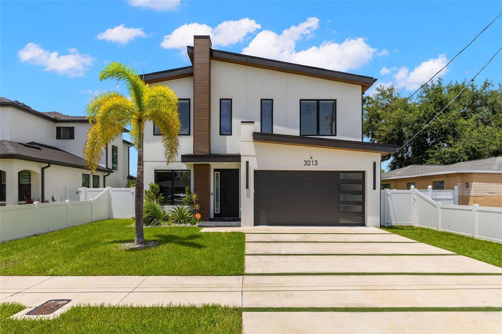 GORGEOUS POOL/OUTDOOR AREA!! Welcome to this sleek and stylish 4-bedroom, 3-bath residence offering the perfect blend of luxury and comfort in one of Tampa’s most sought-after neighborhoods. Built in 2023 and thoughtfully upgraded, the home now includes a private pool and spa—ideal for entertaining or relaxing in your own backyard oasis. Inside, the open-concept layout is both impressive and inviting, with soaring ceilings, a custom brick accent wall along the staircase, and upscale finishes throughout. Modern cement-look tile floors span the first level, while wood-style flooring warms the second. The kitchen is a true showpiece—highlighted by quartz countertops, a waterfall island, sleek cabinetry, and dramatic dark-and-gold fixtures. The spacious primary suite offers a spa-inspired bathroom with a free-standing soaking tub, dual vanities, and a large walk-in closet. Upstairs, you'll also find the laundry room and generous closet space throughout the home. A 2-car garage adds both convenience and storage. Just minutes from Raymond James Stadium, Tampa International Airport, International Plaza, and top-tier dining and entertainment, this home delivers unmatched access and lifestyle with no HOA and no CDD fees.
If you’re seeking turnkey luxury, modern design, and a prime location—this is the one. Schedule your private showing today.