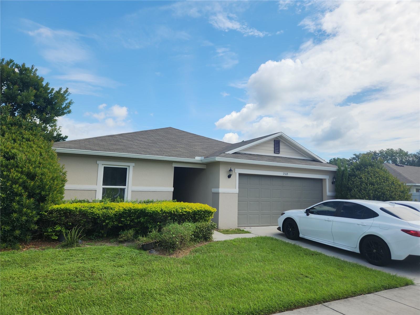Don’t miss your chance to own this stunning 4-bedroom, 2-bathroom single-family home built in 2018, offering 1,701 sq. ft. of comfortable living on a 0.183-acre lot in one of Lakeland’s most sought-after community of Cayden Reserve in North Lakeland! Step inside and be greeted by an open, light-filled floor plan featuring, upgraded tile in wet zones, and carpet in the bedrooms for ultimate comfort. The great room’s airy volume ceilings create an impressive, luxurious feel—perfect for relaxing or entertaining. The modern chef’s kitchen is a true showstopper, offering 36-inch upper cabinets, a spacious island, a generous pantry, and sleek Whirlpool appliances to inspire your culinary creations. Tucked at the back of the home for added privacy, the serene master suite boasts a walk-in closet, an extended dual-sink vanity, and a shower/tub combo with elegant tile surround. The extended 2 car garage provides ample storage space, adding both convenience and function. This move-in ready gem combines style, comfort, and thoughtful design. Outside of the home, you’ll enjoy easy access to nearby shopping centers, restaurants, and everyday essentials. Local parks, fitness centers, and recreational spots provide opportunities for outdoor fun and staying active. With schools, coffee shops, and family-friendly activities just minutes away, this location blends comfort, convenience, and community.