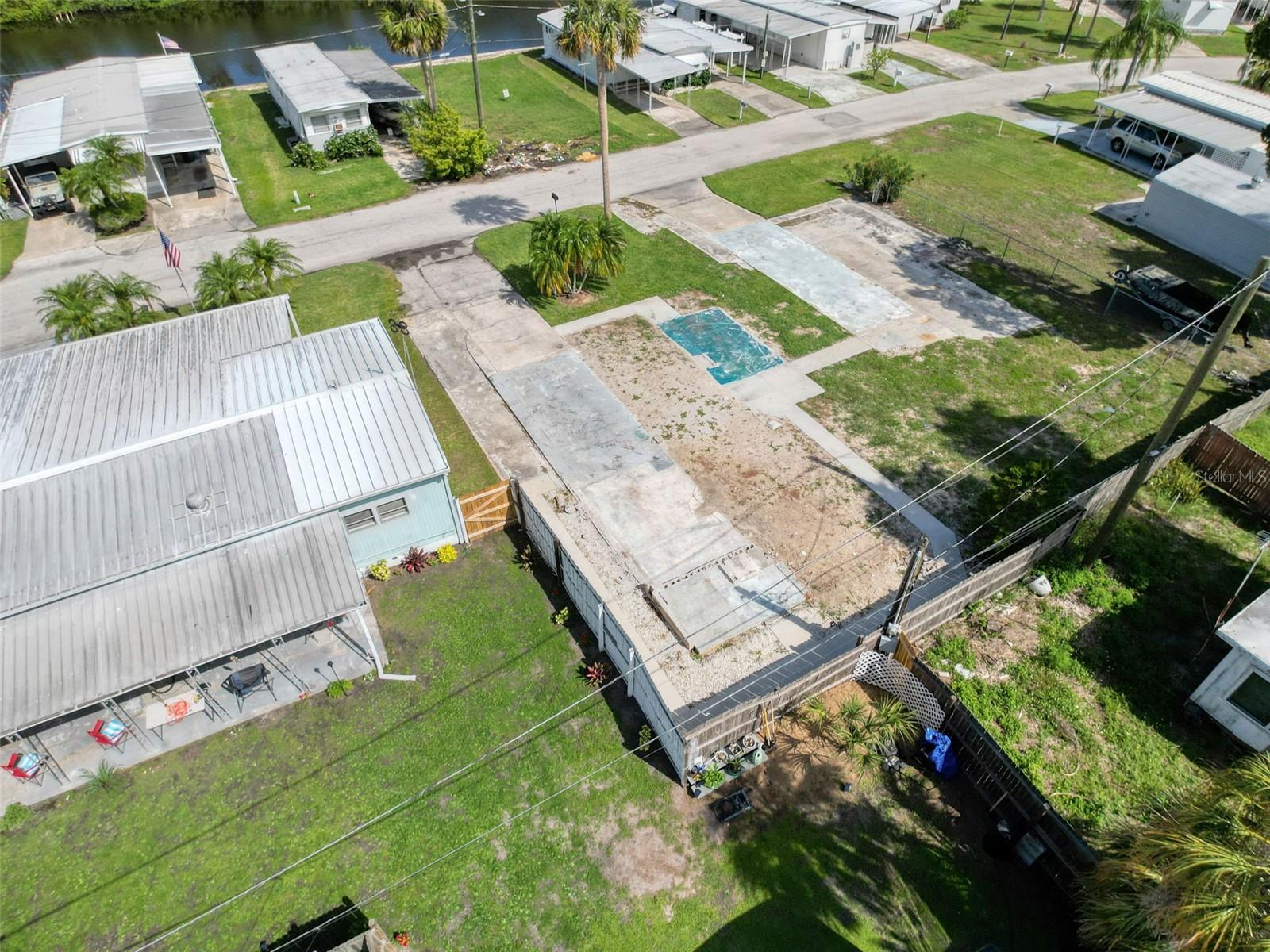 Prime Double Lot in Edgewater Gardens – Minutes from the Gulf!
Welcome to your next investment or dream home site in the heart of Edgewater Gardens! This double lot (80’ x 80’) offers endless possibilities and is ideally situated just 2 miles from the sugar-sand shores of Green Key Beach – your very own slice of paradise on the Gulf of Mexico.
Only 1 mile from historic downtown New Port Richey, you'll enjoy easy access to Sims Park, which hosts frequent concerts, festivals, and community events. Explore a vibrant scene filled with unique restaurants – from sushi spots to cozy wine bars – along with a bakery, cigar lounge, and the beautifully restored Hacienda Hotel, a treasured local landmark.
This lot previously hosted a mobile home, so utilities are already in place – including water, electric, and paid impact fees – saving you thousands in development costs. With new construction just down the street, the area is growing fast, making this a smart buy for builders, investors, or anyone ready to build a coastal retreat.
Zoned for flexibility and nestled in an established community, this is your chance to own a piece of Florida's West Coast charm in a superb location that truly has it all.
Don’t miss this rare opportunity – double lots this close to the beach and downtown don’t come around often!