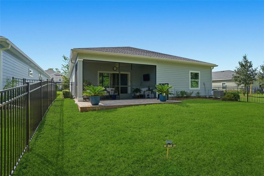 DON'T WAIT TO BUILD, LIKE NEW and NOW REDUCED! *Seller providing $10,000 FLEX CASH with accepted offer* This stunning last of it's kind TREVI Floor plan that has been discontinued is now available. This 4-bedroom, 3-bath residence with TWO EN-SUITES combines modern design! $13,000 in owner upgrades and nearly $36,000 in builder enhancements, create a home that's truly better than new. 

Welcome to an Immaculate home in a community that celebrates Food Truck Friday nights near the amenity center! Impeccably maintained, fully upgraded, and move-in ready. MULTI-GENERATIONAL possibilities! Like new construction that's been lightly lived in and meticulously maintained, this open-concept layout offers seamless flow between the living, dining, and kitchen spaces-perfect for both everyday living and entertaining.

The kitchen shines with premium finishes and smart storage, including pull-out refuse/recycle bins, and opens to the spacious great room for effortless hosting. Enjoy a long list of thoughtful upgrades, such as: " Epoxy-coated garage flooring with lifetime durability " Garage attic insulation and drop-down ladder for extra storage " Custom laundry room cabinetry for organization " New great room ceiling fan and upgraded lighting fixtures " Black aluminum fully fenced backyard for privacy and security " Extended 8.5'x19.5' paver patio and screened lanai for outdoor enjoyment " Rain gutters and relocated irrigation lines for improved drainage and maintenance " Wall-mounted folding bike racks for added functionality " Updated lighting and ceiling fans " Additional Garage and en-suite insulation added in 2023 " Laundry Cabinets added for additional storage Nestled on a PREMIUM CONSERVATION LOT ($22,900 value) with no rear neighbors and limited view of next-door neighbors because of setbacks, this home offers peace and serenity rarely found. The split-bedroom layout includes a spacious primary suite and a second en-suite bedroom, perfect for guests or multi-generational living. 

Discover Granary Park a gated, family-friendly community in Green Cove Springs where modern living meets small-town charm. Enjoy resort-style amenities including a pool + splash pad, clubhouse + fitness center, dog park, and playgrounds surrounded by nature trails. Conveniently located near Lake Asbury schools, shopping, and dining, with easy access to the First Coast Expressway for a quick commute to Jacksonville or Fleming Island. Whether you're relaxing poolside or gathering with neighbors at the clubhouse, life at Granary Park is all about connection, comfort, and community. Located in a quiet, friendly community filled with amazing amenities, including a dog park. 

Close proximity to NAS, Camp Blanding, Green Cove Springs, Middleburg, and Fleming Island! *$10,000 FLEX CASH for buyers choosing from seller at closing* PLUS..1% credit up to $4,000 toward buyer closing costs and prepaids (VA buyers get the lender fee waived, saving them $1,640 extra) when loan is secured through Moises Hall Rate Mortgage, NMLS2299273