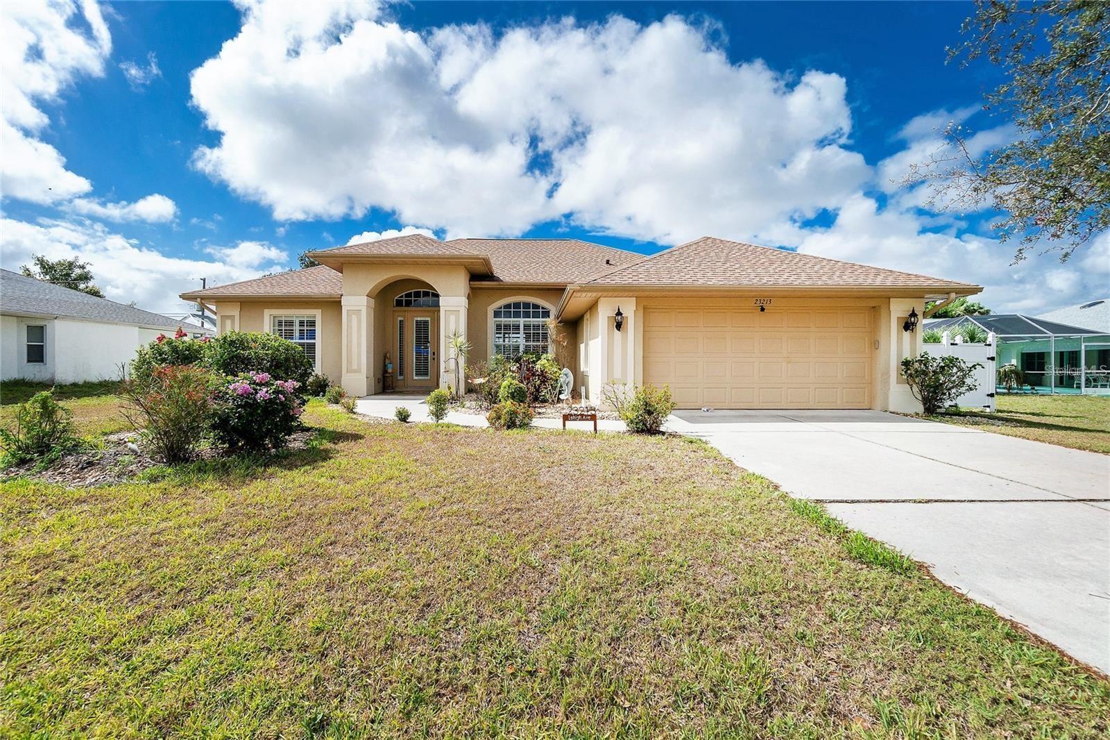 This spacious 3-bedroom, 2-bathroom pool home with a 2-car garage offers 2,000 sq ft of comfortable Florida living. Designed with an open and split floor plan, it provides both space and privacy. As you walk in, you're welcomed by a bright living and dining area with vaulted ceilings, tile flooring, crown molding, and tray ceiling details. Large sliding glass doors lead to a screened lanai and sparkling pool, blending indoor and outdoor living perfectly. The modern kitchen features granite countertops, a pantry, raised panel cabinets with crown molding, a breakfast bar, and a cozy breakfast nook. It overlooks the main living areas, making it perfect for hosting family or guests. The master suite is a peaceful retreat with private pool access, a walk-in closet plus a second large closet, tray ceilings with crown molding, and a spacious en-suite bathroom with dual vanities, a soaking tub, and walk-in shower. Outside, enjoy your private screened lanai and pool—great for relaxing or swimming on hot days. The fenced backyard adds privacy. This home has been well cared for by its original owner and is move-in ready. Located in a desirable area of Port Charlotte, you're close to shops, restaurants, entertainment, and outdoor activities. This home truly has it all—schedule your showing today and enjoy the Florida lifestyle!