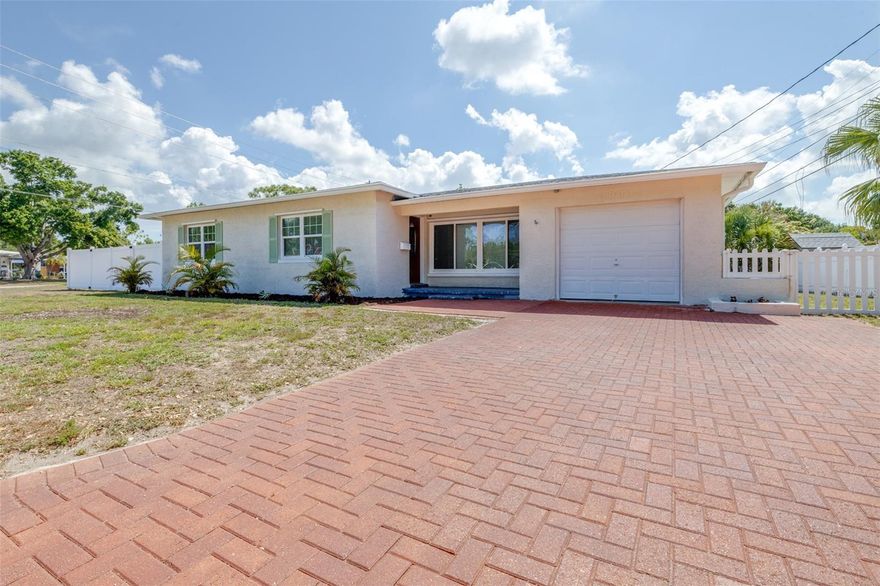 Welcome to your future home! This 2 bed 1 bath is the perfect space to move right in and make your own. This large corner lot features an oversized front and backyard where you can park an RV or boat, build a backyard oasis, and soak up everything the heart of St Petersburg has to offer. Highlights include a beautiful updated coastal blue bathroom with a soaking tub, a freshly painted exterior and interior, a kitchen island for all your storage needs with a hidden garbage can Bedroom closets include new custom shelving. Enjoy convenience of shopping plazas, major highways and intersections, 10 minute drive to downtown St Pete, and less than 20 minutes to the nearest beach. Watch the sun set from your front porch! Roof (2017), AC (2018) regularly serviced and maintained, Washer/Dryer (2021), Water Heater (2011). Perfect for first-time homebuyers or those looking for a solid investment opportunity—schedule your private showing today Bedroom closets include new custom shelving. Enjoy convenience of shopping plazas, major highways and intersections, 10 minute drive to downtown St Pete, and less than 20 minutes to the nearest beach. Watch the sun set from your front porch! Roof (2017), AC (2018) regularly serviced and maintained, Washer/Dryer (2021), Water Heater (2011). Perfect for first-time homebuyers or those looking for a solid investment opportunity—schedule your private showing today!