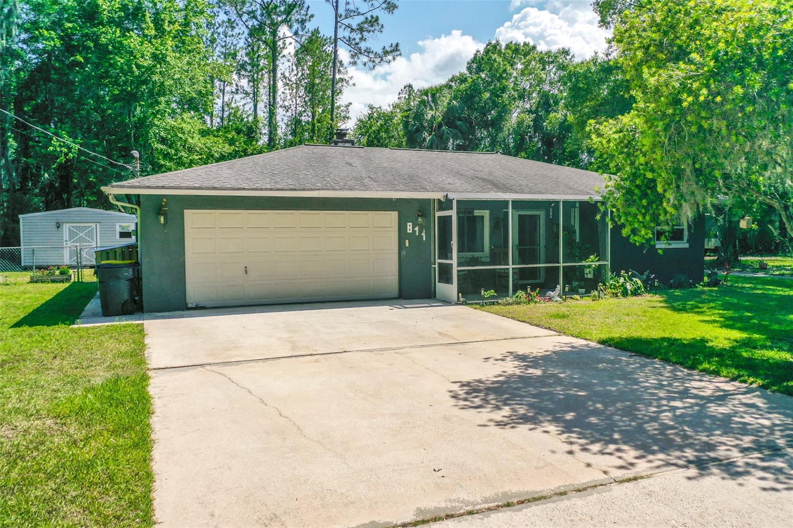 Welcome to the oasis of Bunnell, Florida! This stunning property offers a charming and spacious 3-bedroom, 2-bath block pool home, nestled on a generous 1/4 acre of land with delightful amenities that are sure to impress. With a 2-car garage, summer patio, entertaining area, multiple sheds, and 2 driveways capable of holding cars, boats and RV's this listing has everything you need for comfortable living and endless outdoor enjoyment.
As you step inside the home, you'll immediately notice the warm and inviting ambiance that flows throughout. The open-concept layout effortlessly connects the living, dining, and kitchen areas, creating a perfect space for family gatherings and entertaining guests. The living area boasts abundant natural light, enhancing the welcoming atmosphere. The well-appointed kitchen features included appliances, ample cabinetry, and a convenient breakfast bar, making meal preparation a breeze.
The primary bedroom is a true retreat, offering a peaceful sanctuary for relaxation. With its generous size, and access to the pool, it easily accommodates a king-sized bed and includes a private en-suite bathroom, complete with a stand up shower and vanity. The two additional bedrooms are spacious and versatile, ideal for accommodating family members, guests, or transforming into a home office or hobby space to suit your needs. A second full bathroom serves these bedrooms, ensuring everyone's comfort and convenience.
Now, let's step outside into your private oasis. The highlight of this property is the fabulous pool area, perfect for enjoying the warm Florida climate and entertaining family and friends. The sparkling pool invites you to take refreshing dips during the summer months while the surrounding summer patio and entertaining area provide an ideal spot for outdoor dining, barbecues, and socializing.
For those with hobbies or in need of extra storage, this property has a shed, providing ample space for all your equipment, tools, and recreational gear. Whether you have a green thumb, enjoy woodworking, or need space for your water toys, these sheds are an excellent addition to this already exceptional property.
Situated on a 1/4 acre of land, the property provides plenty of room for outdoor activities and offers potential for landscaping and gardening enthusiasts to create their own personal paradise. The neatly manicured grounds enhance the property's curb appeal and contribute to the overall sense of pride and ownership.
Conveniently located in Bunnell, you'll enjoy easy access to the beach only 8 miles away, local amenities, schools, shopping centers, and dining options, ensuring a comfortable and convenient lifestyle. With its desirable features, spacious interiors, and impressive outdoor spaces, this 3-bedroom, 2-bath pool home on 1/4 acre of land is a true gem that offers the perfect blend of comfort, style, and entertainment.
Don't miss out on this exceptional opportunity! Contact us today to schedule a showing and make this wonderful property your new home.
