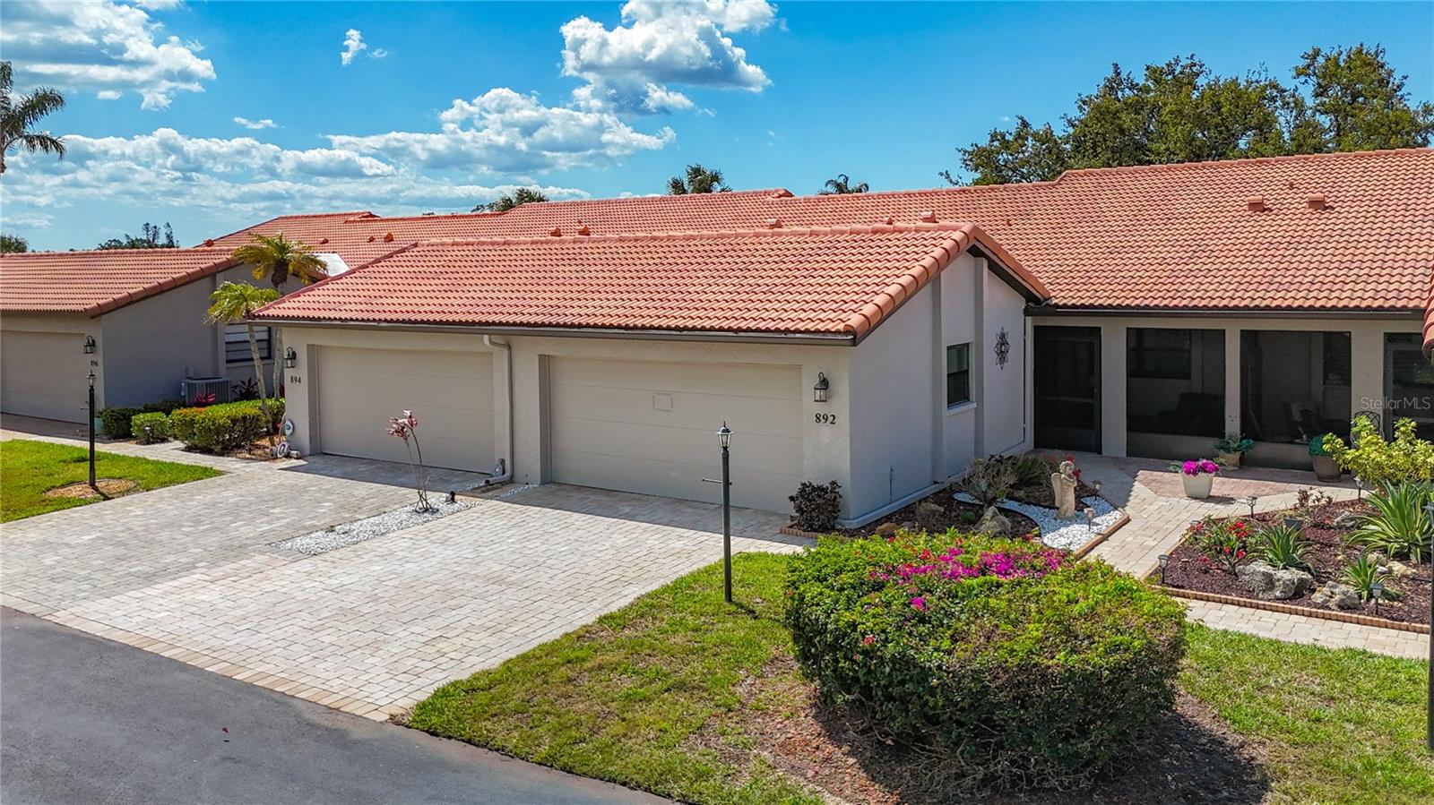 Life is Full of Choices . . . a few steps to the Heated Pool OR a short drive to the beautiful sandy of Florida’s Gulf Beaches! Your Florida Escape Awaits! Welcome to Jacaranda Country Club Villas, a warm, friendly maintenance-free 55+ community (only one owner need be 55). This beautifully remodeled villa is perfect for full-time residency or as your winter retreat! It offers the best of Venice, Florida living and is being offered Turn Key Furnished with Quality Furnishings!!! This Villas offers a rare Screened Front Porch with updated flooring. Inside and you’ll be welcomed by a bright, Fully Renovated Kitchen featuring Raised Panel Cabinetry, Exotic Granite Countertops, Modern Appliances, Composite Kitchen Sink, and a cozy Eat-in Area. A Large Breakfast Bar opens the Kitchen directly into the Living Area which includes a Spacious Dining Room and Great Room with Vaulted Ceilings. The interior layout is Open yet Practical, Functional and Efficient!!! The Great Room, with its wall of sliding doors, opens to an Oversized Lanai with river rock stone flooring and tropical views. Highly unique is that both Bedrooms are larger than the size of most owner suites. Both Bathrooms have been updated with New Vanities, Lighting, Fixtures, and Showers. Additional highlights include..... Washer and Dryer..... Hurricane-rated Windows with Upgraded Blinds..... New Hurricane-rated Garage Door..... New Kevlar type Hurricane-rated Sliding Glass Door Enclosure..... and the Tile Roof was replaced in 2013 providing years of future security! Let’s talk location..... Venice offers dozens of Golf Courses nearby. Explore miles of beaches including Venice Beach, Caspersen, Nokomis, Manasota Key, and world-famous Siesta Key. Enjoy Gorgeous Sunsets, Drum circles, Sport Fishing, Boating, Major League Baseball Spring Training, Festivals Year-Round and Professional Sports. Stroll charming Venice Avenue for Shopping, Dining, and Live Music. This is the Florida lifestyle you’ve been dreaming of in an established community with established budgets that have stood the test of time and value. Florida is calling, don’t miss your opportunity! Schedule a Tour today!