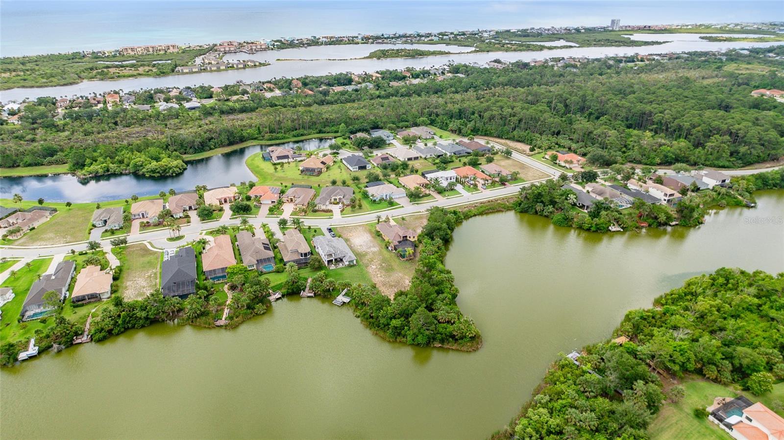 Discover the perfect blend of privacy, luxury, and nature with this .49-acre lakefront lot in the highly desirable Palm Coast Plantation—a premier gated community located on the Intracoastal Waterway in Palm Coast, Florida. This oversized homesite backs to a scenic lake, offering tranquil water views and the ideal setting for your custom-built dream home. Enjoy resort-style living with world-class amenities, including a lagoon-style swimming pool with lap lanes, 7000 Sqft. clubhouse with fitness center, tennis and pickleball courts, basketball, shuffleboard, croquet, and scenic bike and jogging trails. Residents also have access to 126-acre Emerald Lake, perfect for fishing, kayaking, and wildlife watching, plus on-site boat and RV storage. Palm Coast Plantation is just minutes from the beach, top-rated schools, Graham Swamp Preserve, and the best shopping and dining Palm Coast has to offer. With curb-and-guttered streets, 24-hour gated security, and beautifully maintained common areas, this community offers an unmatched lifestyle on Florida’s scenic coast. Don’t miss this rare opportunity to build your lakefront dream home in one of Flagler County’s most sought-after neighborhoods!