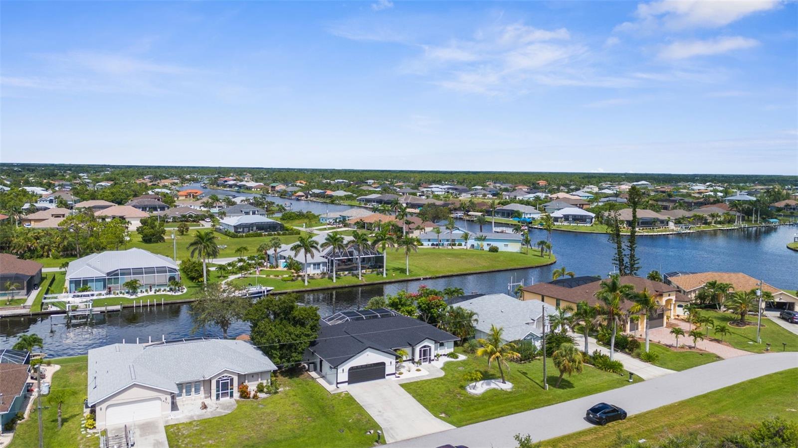 NEVER EXPERIENCED FLOODING. This stunning, fully remodeled coastal retreat has never experienced water intrusion and withstood the last several hurricanes without a scratch. Located in the highly sought-after South Gulf Cove community, you’ll enjoy direct Gulf access in just 10 minutes from your 30-foot concrete pier with a 13,000-pound boat lift—perfect for serious boaters.RECENT UPGRATES INCLUDE:Brand-new IMPACT WINDOWS & SLIDING DOORS (2025).New air conditioning system (2024).New roof (2024).Complete pool renovation: new equipment, resurfacing, and screened lanai (2024)
You’re just minutes from medical facilities, grocery stores, restaurants, and more—yet you’ll feel like you’re on vacation every day. South Gulf Cove offers the ultimate Florida lifestyle: boating, fishing, and year-round sunshine.
Don’t wait! Call today to schedule your private showing of this beautiful home—you’ll be glad you did!