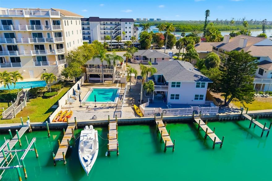 An exceptionally rare opportunity to acquire a fully renovated, income-producing, nine-unit, waterfront condominium complex located
adjacent to Turtle Beach on world-renowned Siesta Key. Coral Shores offers immediate short-term rental income opportunity, paired with long-term redevelopment and appreciation potential, in one of Florida’s most supply-constrained coastal markets. 

Property Highlights:
• Nine (9) condominium units sold as a package
• Just under 0.50-acre waterfront site
• Direct Sarasota Bay to Gulf of Mexico access – no bridges
• Four private docks with eight slips (up to ~40’+ vessels)
• Heated in-ground swimming pool
• Large central parking lot for tenants and guests
• Shared laundry and owner storage facilities
• Predominantly 2BR units with select 1BR and studio layouts

Renovations & Interior Upgrades: 
All units have recently completed extensive renovations featuring modern coastal interiors, updated kitchens with new appliances, stone countertops and new cabinetry, glass-enclosed contemporary bathrooms, new flooring, trim, windows, and select in-unit laundry, new common pay laundry appliances with storage closets, new raised HVAC units, new pool pump equipment, and more. The property is fully turnkey for continued short-term rental use. 

Income & Zoning Upside: 
Currently operating as weekly short-term rentals with strong seasonal occupancy. Zoned for low-rise condominiums (2–3 stories), with surrounding properties zoned mid-rise (4–6 stories), providing future redevelopment or density expansion potential subject to approvals.

More detail is available with executed NDA. Call listing agent to obtain NDA.