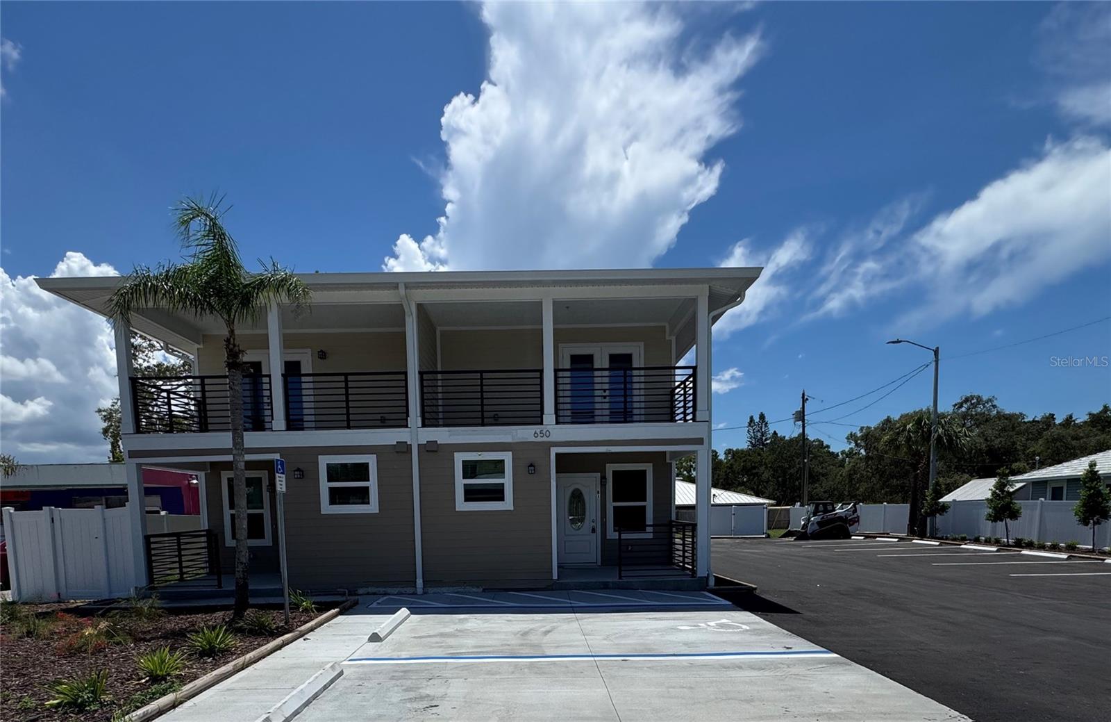 Be the first to live in this beautiful second-floor unit in a newly constructed 6-unit complex, just steps from downtown Tarpon Springs. This light, bright, and modern apartment features a spacious split floor plan, granite countertops in the kitchen and both bathrooms, and stainless steel appliances throughout. Enjoy the Florida breeze from your private balcony overlooking Tarpon Avenue, perfect for relaxing or entertaining. Each unit includes two full bathrooms, laundry hookups, and clean, contemporary finishes throughout.