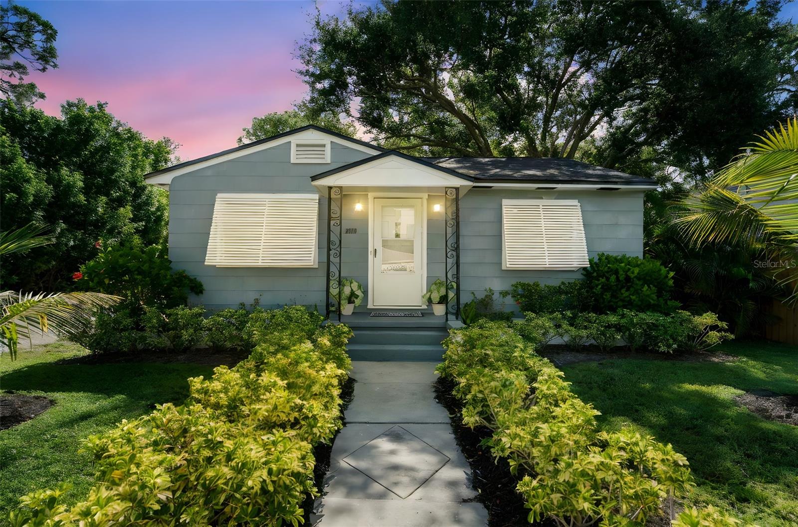 Timeless charm meets modern ease! This Gulfport bungalow is rich with vintage character that coexists perfectly with modern amenities. Original chocolate-stained wood floors, coved ceilings, archways, cedar closets and classic Bahama shutters all give a warm nod to yesteryear. Yet, tasteful renovations throughout elevate the home to today’s lifestyle. The kitchen is a standout, featuring extended white shaker style cabinetry, stone countertops, a subway tile backsplash, stainless steel appliances and has plenty of space for a dining table. A split bedroom layout ensures both privacy and convenience. The two guest bedrooms share an updated main bathroom which echoes the home’s contemporary aesthetic. A major bonus? The garage conversion - separated by a breezeway, utility room, and second full bath - offers incredible flexibility. Use it as a spacious primary suite, home office, studio, fitness room, or take advantage of the layout for house-hacking. With two separate entrances, its ideal for multigenerational living or potential rental income. Coveted alley access makes coming and going a breeze, easily pull in your boat, golfcart or recreational vehicles. The backyard is lined with lush Areca palms for added privacy and a tropical vibe, while coconut palms and thoughtful landscaping in front enhance the home's curb appeal. The list of upgrades since 2019 has been extensive: roof, AC, replaced sewer line, and tankless hot water heater. These improvements will guarantee the new owner years of stress-free living and peace of mind. Located just blocks from everything that makes Gulfport so adored: colorful festivals, quirky boutiques, award-winning waterfront dining, and the Tuesday Morning Market. Don’t forget the sunset strolls along the beach or Williams Pier! Whether you're searching for a full-time home, vacation escape, or a savvy investment, this home offers an ideal blend of comfort, character, and coastal lifestyle.