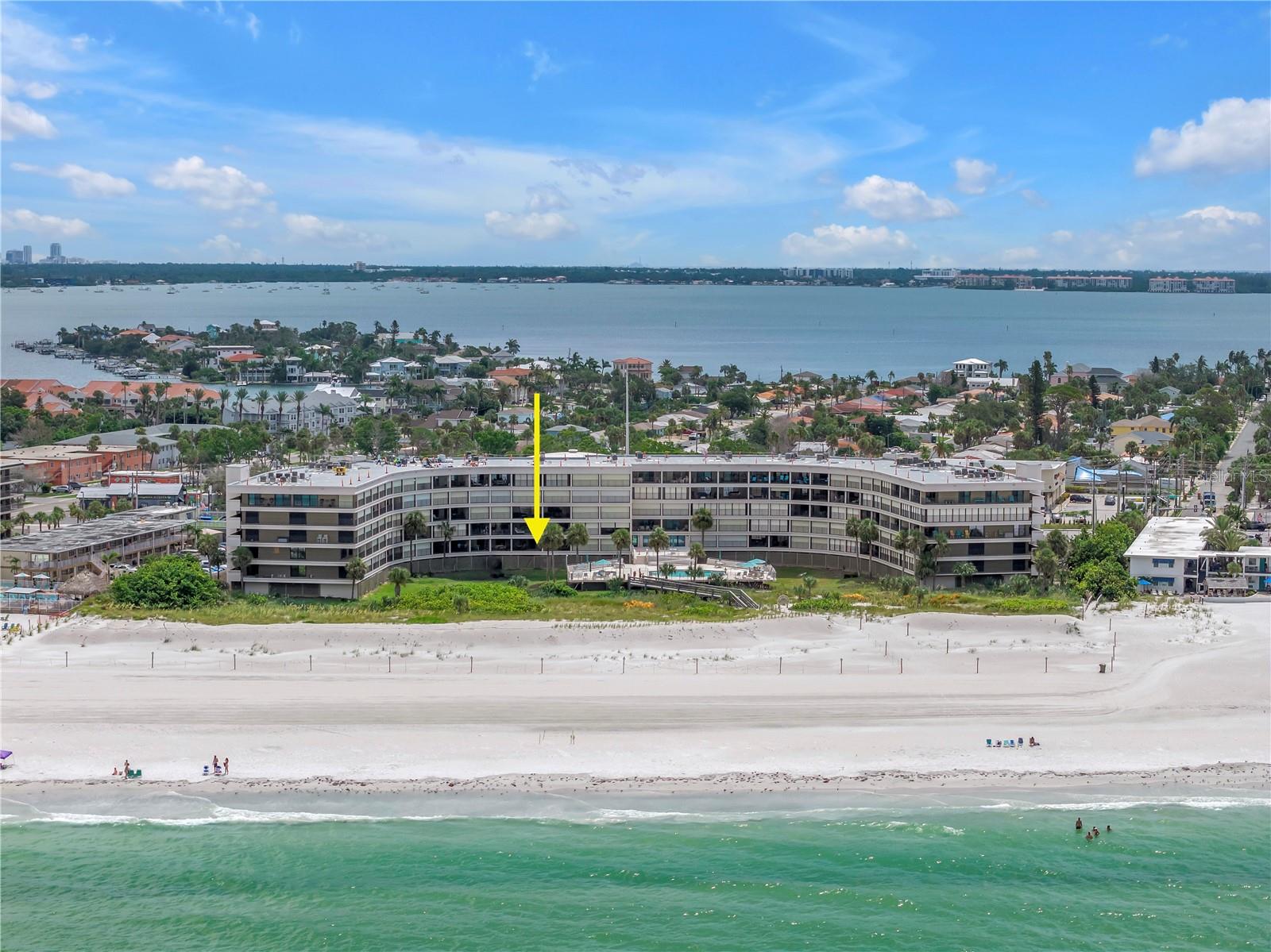 The Lido condominium on St. Pete Beach has proven its resilience by withstanding a significant 100-year storm event. While the landscaping suffered damage, the building itself remained unscathed, thanks in part to the protective beachside dunes. Efforts are currently underway to restore these dunes and replant sea oats to reinforce this natural barrier. Phase I to plant new salt tolerant landscaping began in July 2025.
Unit 110, situated at the center of The Lido’s U-shaped design, offers direct Gulf views and overlooks the pool and hot tub. Positioned on the second level, above the under-building garage, this unit features a spacious balcony with unobstructed vistas of the Gulf of Mexico. The condo comprises two generous bedrooms, two bathrooms, a large living and dining area, and a well-appointed kitchen with ample cabinetry and preparation space. The master bedroom accommodates substantial furniture and includes an ensuite bathroom with a walk-in closet and dual sink areas. The second bedroom is sizable enough for two queen beds, and a flexible space can serve as an office, breakfast nook, or additional sleeping area. A full-sized washer and dryer are conveniently located within the unit. Offered fully furnished, this condo is move-in ready, suitable for both full-time living and part-time residency.
The Lido community consists of 74 units and offers amenities such as a pool, community room, tennis court (also lined for pickleball), and a fitness room. In 2022, the Gulf-side pool and pool deck were completely replaced, and residents have access to a private walkway leading to the pristine sands of St. Pete Beach. Each unit includes an under-building parking spot, with additional parking available for second vehicles and guests in the front lot. A new roof was installed in 2025. The location provides convenient access to grocery stores, pharmacies, restaurants, and is approximately a seven-minute drive to I-275, offering quick routes to downtown St. Petersburg and the St. Pete/Clearwater or Tampa International airports.
