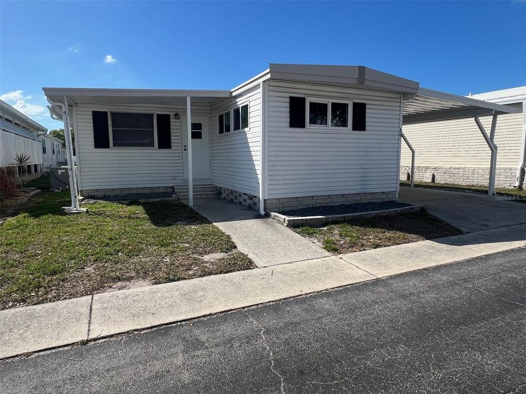 Photo of 66 Thatch Palm Street W, Largo, FL 33770 (MLS # TB8484071)