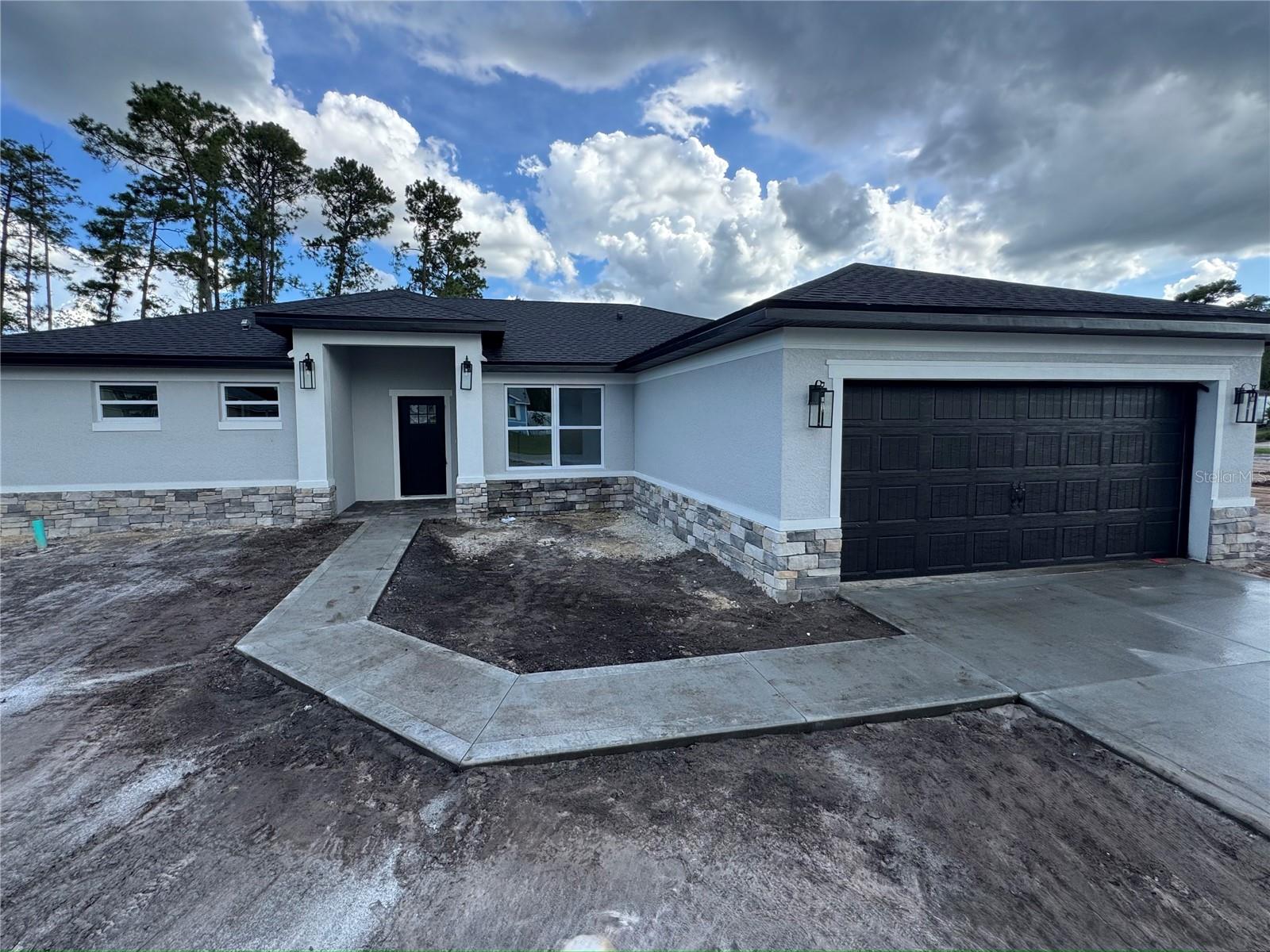 Brand-New Four-Bedroom Modern Beauty – Built in 2025! Step into this stunning new construction home boasting an open and light-filled floor plan designed for today’s lifestyle. The kitchen features premium stainless steel appliances, sleek quartz countertops, it's equipped with an oversized deep-basin sink AND a large pantry for all your storage needs. Elegant bathrooms offer both style and comfort, with designer tile to the ceiling! While the luxurious master suite impresses with tray ceilings, a spa-inspired shower with dual showerheads, and a huge walk-in closet you’ll love. This thoughtfully designed home combines contemporary elegance with spacious living areas that flow effortlessly. The thoughtfully designed laundry room comes equipped with a built-in sink, adding convenience and functionality to your daily routine.. This is the move-in-ready dream home you’ve been waiting for. Schedule your tour before it's gone! UPDATED PHOTOS COMING SOON
