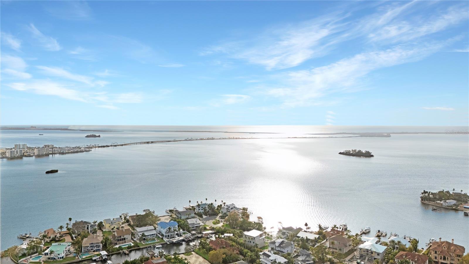 One or more photo(s) has been virtually staged. One or more photo(s) has been virtually staged. This charming 2-bedroom, 2-bath ground-floor condo in the highly sought-after Harbor Club Community offers a blend of comfort, convenience, and relaxation. The spacious unit features an open-concept layout with plenty of natural light, making it the perfect place to unwind. The kitchen includes stainless steel appliances and an indoor laundry for your convenience. The living area seamlessly connects to a private patio, ideal for outdoor dining or simply enjoying the serene surroundings. The primary bedroom and second bedroom include an en-suite bathroom for added privacy. Residents of Harbor Club enjoy access to fantastic community amenities, including a clubhouse, 2 pools (main pool heated), a rejuvenating hot tub, and tennis courts—perfect for active outdoor living. The community's prime location is a short distance from beautiful beaches, offering easy access to sun, sand, and surf. Whether you're looking for a vacation retreat or a place to call home, this condo offers the perfect combination of lifestyle and location in one of the most desirable neighborhoods around. Call now to schedule your showing and start packing!