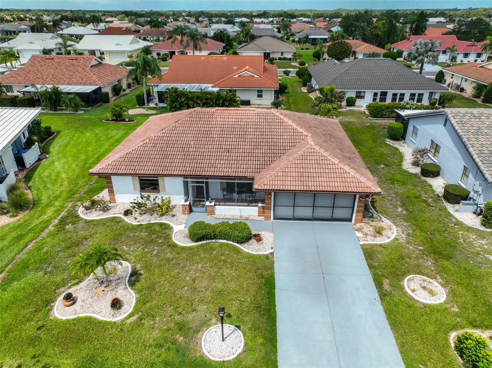COME LIVE UNDER OUR SUN IN SUN CITY CENTER'S 55+ COMMUNITY!
Welcome to this light and bright Pinehurst model featuring 2 bedrooms, 2 baths, and located in the desirable Greenbriar neighborhood. Enjoy a spacious living room with a separate dining area, and a cozy kitchen with a charming breakfast nook perfect for casual meals and entertaining.
The airy Florida room, opens into the living room, is filled with natural light and ideal for relaxing or hobbies. The split-bedroom floor plan offers privacy, with a spacious primary suite that includes a large walk-in closet and an en-suite bath with a shower. The guest bath features a new high vanity and a glass-enclosed tub/shower.
The oversized 2-car garage includes a washer and dryer, plus ample storage space. Notable updates include:
Roof (2007)
HVAC (approx. 4 years old)
Electric panel replaced
Plumbing re-piped
Florida room enclosed (2018)
Irrigation meter (1999)
Flooring is ceramic tile throughout, with carpet in the guest bedroom. Enjoy your morning coffee on the screened front porch or unwind in the large, screened back patio.
Put this one on your MUST-SEE list!
Sun City Center offers world-class amenities: multiple clubhouses, fitness centers, indoor/outdoor pools, pickleball, softball, arts & crafts, woodworking, dance, lawn bowling, over 150 clubs, and optional Club Renaissance & 63 holes of golf! Conveniently located near Tampa, Sarasota, St. Pete, airports, beaches, shopping, dining & more