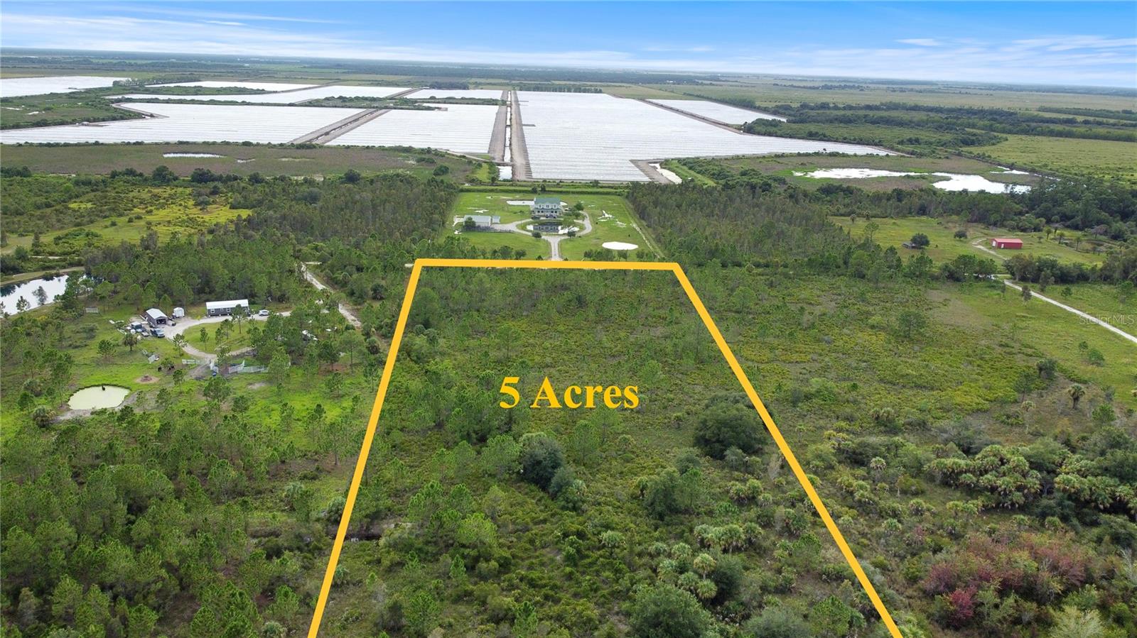GOLDEN RANCHES 5-ACRE PARCEL — AG ZONED, NO HOA, YOUR LAND YOUR RULES. This Charlotte County FL acreage sits high and dry outside flood zones with Agriculture zoning that allows residential, farming, animals, barns, and workshops with ZERO deed restrictions. Survey's complete, road access confirmed, and native saw palmetto throughout (no official wetland delineation yet, but land appears generally dry). Located in one of Punta Gorda's last unrestricted rural neighborhoods where you can actually build, farm, or play without asking permission — adjacent to 150,000+ acres of Babcock Ranch Preserve and Webb Wildlife Management Area for hunting, fishing, and trail riding. Whether you're planning a Florida homestead property, weekend camping getaway, or just want space for ATVs and equipment, this is the freedom you've been searching for.
Golden Ranches parcels are moving FAST as more buyers discover this no HOA Florida land between massive public preserves — perfect for hunting enthusiasts, horseback riders, and anyone tired of neighborhood rules. This Punta Gorda land for sale offers legitimate off-grid land Florida potential with room for gardens, animals (big or small), and whatever else you dream up. Build tomorrow or hold for investment — either way, you own 5 acres of Florida AG zoned property where nobody dictates your timeline or vision.