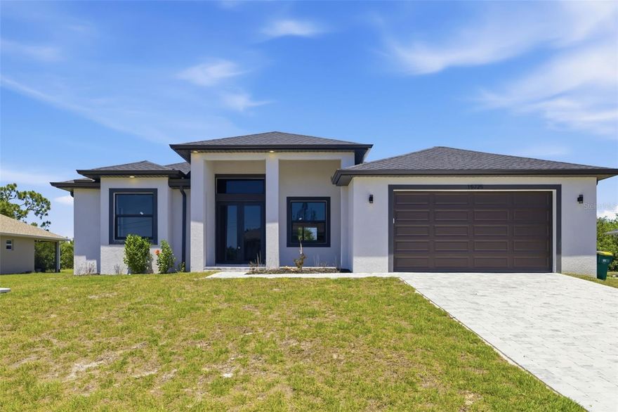 One or more photo(s) has been virtually staged. Welcome to your brand-new Florida retreat at 15725 Autry Circle in beautiful Port Charlotte! Built in 2025, this stunning new construction home showcases elite finishes and modern design throughout. From the moment you step inside, you’ll be impressed by the bright, open floor plan complemented by gorgeous tile flooring and abundant natural light streaming through impact-resistant windows.

The heart of the home offers a seamless flow between the living, dining, and kitchen areas—perfect for both everyday living and entertaining. Thoughtfully designed with comfort and style in mind, every detail reflects quality craftsmanship and contemporary elegance.

Step outside to enjoy a spacious backyard with no direct rear neighbors, providing a rare sense of privacy and serenity. The peaceful setting captures the essence of “Old Florida” charm, offering a tranquil atmosphere that feels worlds away while still being conveniently close to everything Port Charlotte has to explore.

Whether you’re looking for a full-time residence, seasonal escape, or investment opportunity, this exceptional home delivers modern luxury in a relaxed, picturesque setting. Don’t miss your chance to own a slice of Florida paradise!