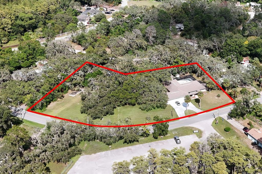 Photo of 8976 Lake Drive, New Port Richey, FL 34654 (MLS # TB8430996)