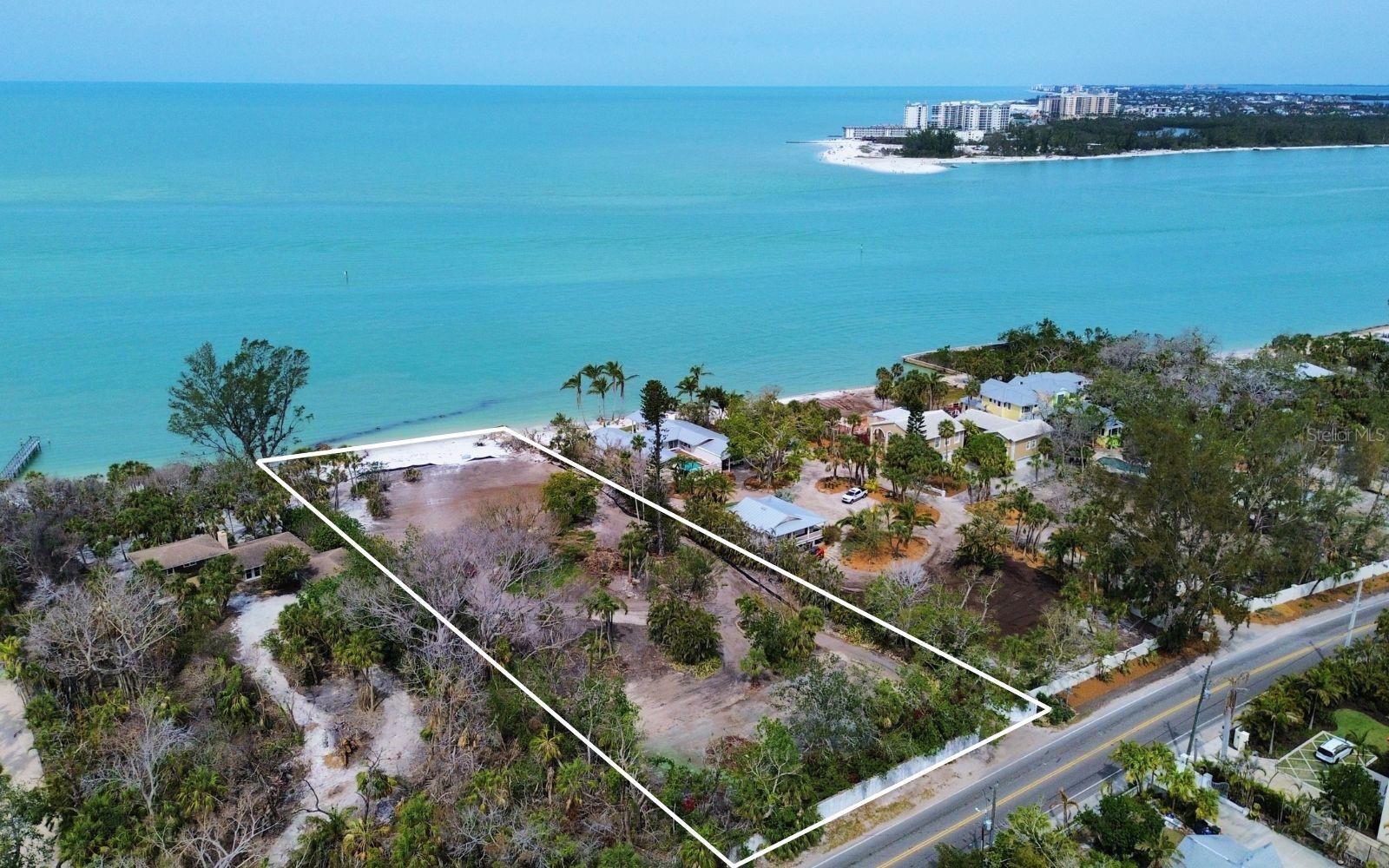 For the first time in 35 years, 4214 Higel Avenue is available—one of only 7 estates boasting a private beach on this ultra-exclusive stretch of Siesta Key. Spanning approximately 1.6 acres with an unrivaled 142 feet of private beachfront and 451 feet of depth, this is a rare opportunity to own a generational piece of Sarasota’s most coveted coastline. With direct access to Big Pass and unobstructed Gulf views, this property offers an unparalleled waterfront lifestyle. Whether you envision a modern masterpiece or a timeless beachside sanctuary, this expansive homesite provides the space, privacy, and exclusivity to bring your vision to life. For those seeking inspiration, a separate residential listing features a visionary concept designed by Stofft Cooney Architects and in collaboration with Perrone Construction. Explore MLS#A4646499 to discover the renderings and build opportunities for a truly exceptional home. A property of this caliber is a rarity—don’t miss the chance to build your legacy on Sarasota’s most exclusive shoreline.
