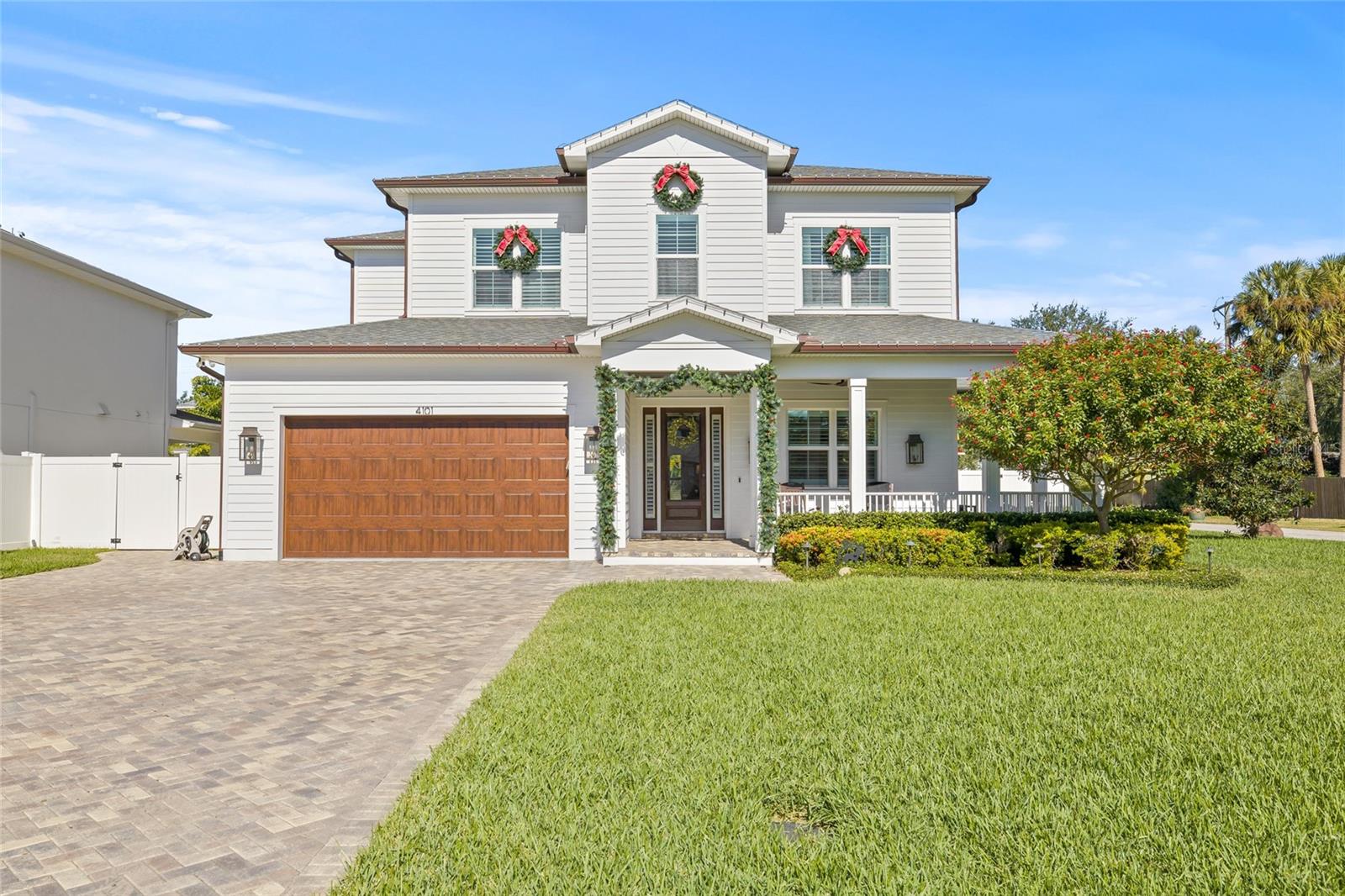 Experience refined elegance in this Barritz Builder's craftsman style masterpiece. Built in 2019, this exceptional home stands as a testament to craftsmanship and design, remaining high and dry through recent storms. Thoughtfully curated with over $350,000 in custom upgrades, it offers luxury at every turn. Step onto the welcoming front porch, the perfect prelude to the elegance that awaits inside. Upon entering you are greeted by an abundance of light cascading through expansive windows and illuminating the soaring ceilings and impeccably crafted details. The heart of the home is a chef's gourmet kitchen, featuring Thermador SS appliances, a gas range, quartz countertops, and a stunning marble tile backsplash. Adjacent to kitchen is the bright and inviting breakfast nook that offers the perfect spot to enjoy casual meals. A butler's pantry with a wine cooler adds convenience for entertaining. The open-concept floor plan flows effortlessly from the kitchen to the great room, with a separate dining room, dedicated office and downstairs bedroom to include pool bath for added functionality. This home boasts 10' ceilings throughout, showcasing impeccable attention to detail, including solid core 8' doors and American Hickory engineered hardwood flooring. The exterior shines with $30,000 in copper gutters and $110,000 in professional landscape and lighting, full in-ground irrigation system with timer, whole house generator and $130,000 in solar panels to ensure energy efficiency and peace of mind. Electric bills are dramatically reduced! Home was built to current hurricane codes. Upstairs, retreat to the luxurious primary suite, complete with tray ceilings, a modern electric fireplace, and an expansive spa-like en-suite. The master bath features dual vanities, a freestanding tub, a glass enclosed shower with three showerheads and two linen towers. The enormous custom walk-in closet is every shoe lovers dream and includes an island with built in drawers designed for even the most discerning wardrobe. Additional features include: Dual tankless water heaters, energy efficient Low E windows, 5 year old Dual-zoned HVAC system, brick paver driveway, surround sound system, security system, whole house water softener, and complete with a 2-10 Home Buyers Warranty. Outdoors enjoy the covered lanai with tongue and groove ceilings. There is a custom saltwater pool and spa, complete with outdoor kitchen, sink and built in gas grill. All is surrounded by lush landscaping, and a fire pit, creating your private oasis. With timeless beauty and state-of-the-art amenities, this home redefines luxury living. Home is located in the heart of South Tampa! Close to shopping, airport, mall and zoned for top rated schools: Grady Elementary, Coleman Middle and Plant High School. Actual sq footage is 4,226 heated and 5,398 under roof.
