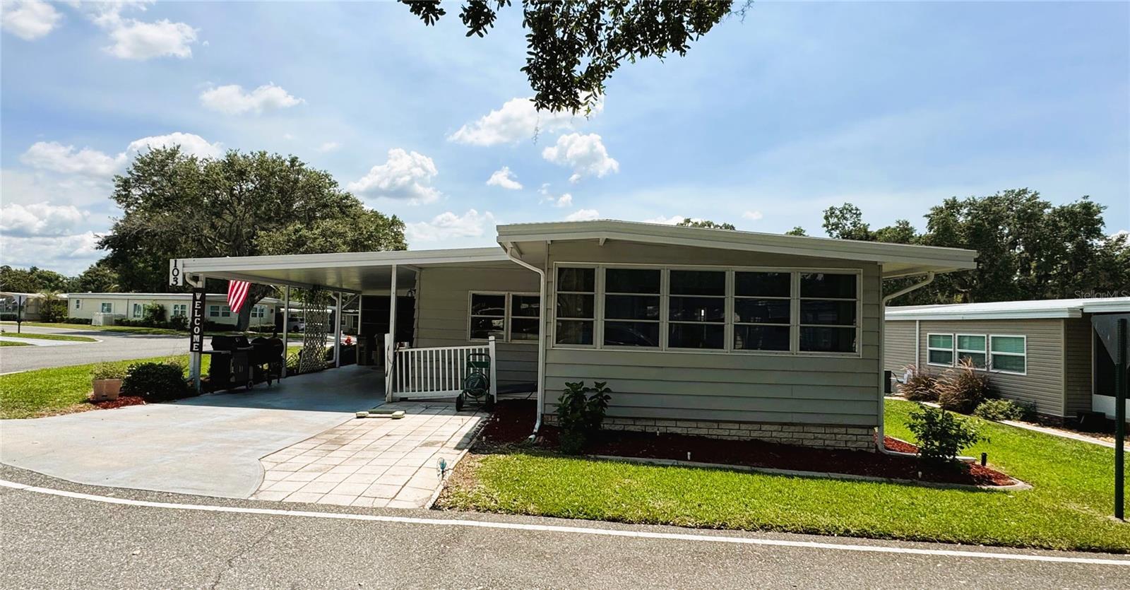 Charming and thoughtfully updated, this two-bedroom, two-bath home is nestled on the beautiful and peaceful Poinsettia Cove. From the moment you step onto the inviting screened porch and enter through the welcoming foyer, you'll feel right at home.
The property has been meticulously maintained and features a number of recent improvements. In 2024, a new water heater was installed, along with a new electrical panel equipped with a surge protector and wiring in the lanai for a future hot tub. That same year, the home received new flooring throughout, a beautifully remodeled bathroom with extra-bright lighting, a new dishwasher, and freshly painted trim. The roof was professionally coated for added durability and both toilets were replaced.
Upgrades continued into 2025 with the addition of a new irrigation system, a Maytag washing machine, and the professionally screened rain gutters for enhanced curb appeal and functionality. The climate controlled laundry area, combined with a spacious workshop, provides ample room for storage and everyday convenience.
Perfect for relaxing or entertaining, this home offers a warm and comfortable atmosphere in a highly desirable location. It’s a wonderful blend of modern updates and classic charm—ready for you to move in and enjoy.
Located just moments from the community pool, clubhouse, and all the amenities that Hawthorne has to offer, this home truly provides comfort and convenience.
Hawthorne at Leesburg is an exceptional 55+ community in the charming city of Leesburg, Florida. This resort-style neighborhood provides active adults with an affordable and comfortable lifestyle. The monthly maintenance fee of $346 covers water, sewer, lawn care, private emergency services, and access to a host of amenities. Secure storage for recreational vehicles, boats, and trailers is also included.
The community's expansive clubhouse is the social centerpiece, accommodating up to 550 guests and offering more than 100 activities. Amenities include a hospitality lounge, card and craft rooms, a billiard room, fitness center, library, and fine arts room. A full-time program coordinator ensures a vibrant calendar of social, recreational, and cultural events.
For boating enthusiasts, the private marina features over 120 boat slips with direct access to the Harris Chain of Lakes. The marina is secured with an electronic system for convenience and peace of mind.
Safety is a top priority at Hawthorne at Leesburg, with a state-of-the-art emergency response system, three emergency vehicles, and 24/7 on-site state-certified firefighter/EMTs. Homes are equipped with emergency alarm buttons for quick response, ensuring resident security even on holidays.
Natural beauty abounds, with scenic views of Lake Harris, nature trails, and plenty of opportunities for boating and fishing. The golf-cart-friendly community allows for easy exploration of the neighborhood and nearby attractions.
Residents can stay active and healthy with multiple pools, walking trails, and a fully equipped fitness center. Conveniently located near shopping, dining, golf courses, and medical facilities, Hawthorne at Leesburg offers a perfect blend of leisure and convenience.