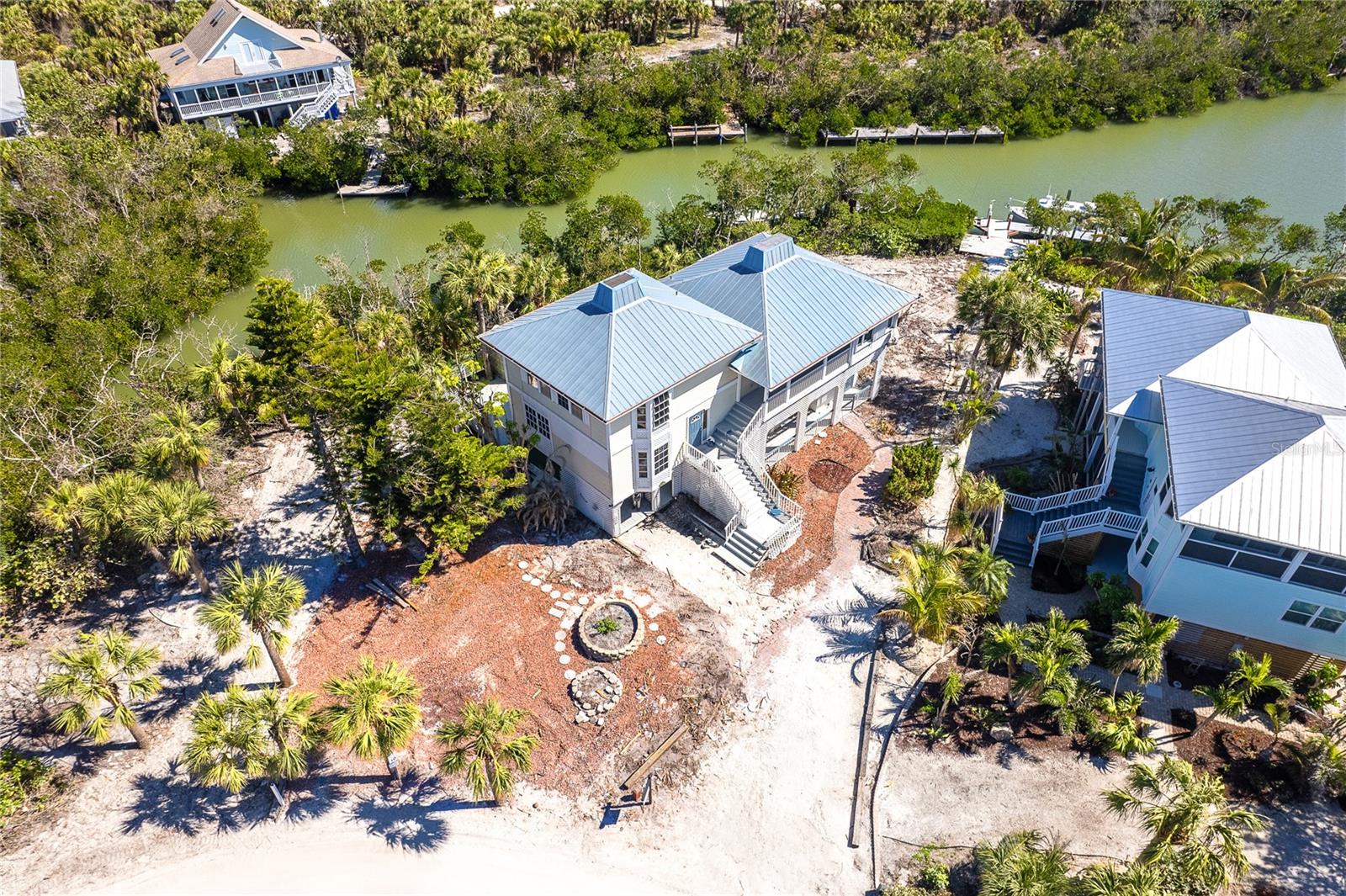 PRICE ADJUSTMENT!!!
Waterfront Island Living on Palm Island, Placida – A True Tropical Retreat!
Escape to paradise with this exceptional 4-bedroom, 3-bathroom home located on the exclusive Palm Island in Placida, offering true island living with breathtaking views. Accessible only by car ferry or your own private boat, this unique property is surrounded by serene waters, providing direct access to the surrounding waterways and Gulf.
Set across three spacious levels, this home offers an open-concept living room and kitchen area that is perfect for entertaining or relaxing while enjoying the tropical surroundings. The upper level views of the canal and lush island landscape are a must see!
With 4 bedrooms and 3 full bathrooms, there’s plenty of space to host family and guests. The lower entrance level offers an attached covered storage area perfect for a golf cart as well as an outdoor shower area ready for your renovating. This home is the perfect opportunity to create your dream home in this beautiful island setting.
The outdoor space is a blank canvas, ready for your landscaping ideas and personal touches—whether it’s creating your own tropical oasis or renovating the existing dock to your specifications.
Bring your visions to life in this tranquil and private waterfront location. This is more than just a home – it’s a lifestyle waiting to be embraced.