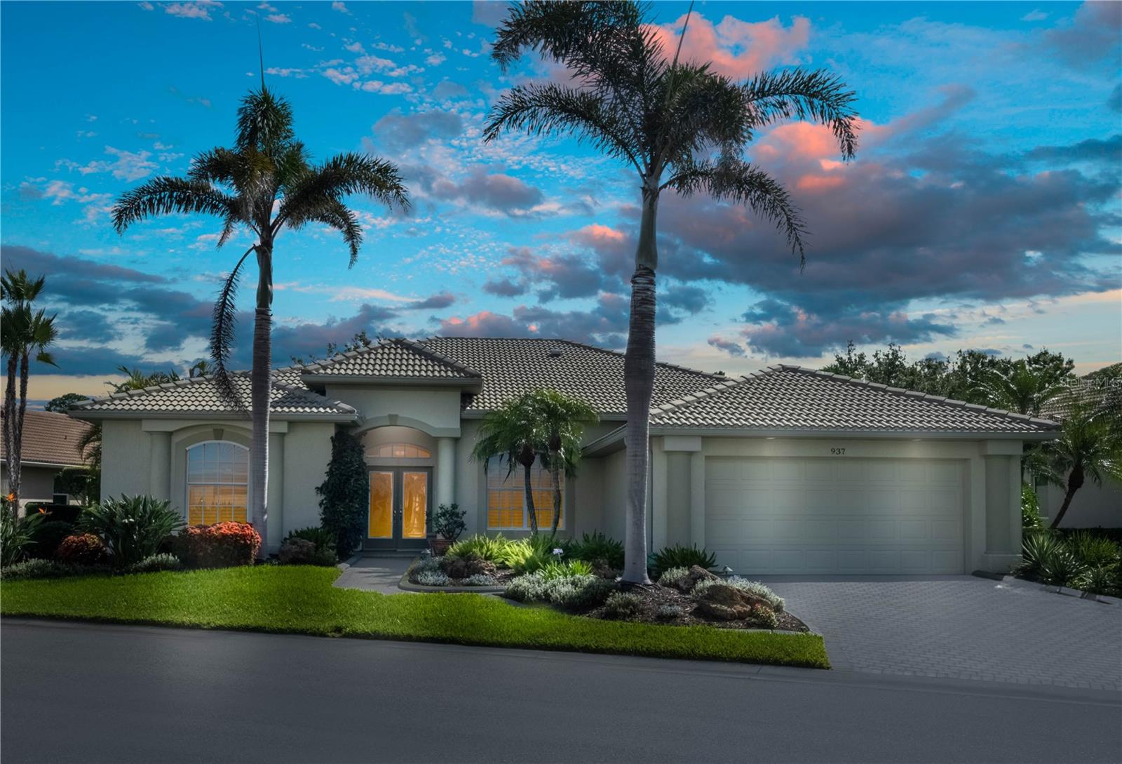 Curb appeal w/custom Landscaping, Dynamic Interior & private tropical pool area is just is beginning. This home is being sold turn key furnished w/a golf cart & Generator. Entering this home is very pleasing w/ all the custom features. It starts with the high ceilings & 10" crown molding thru-out the home. Pocket sliding doors from the great room open to the Tropical pool area w/pavers surrounding the Entire Lanai. This heated pool w/ jacuzzi which flows into the pool is a piece of paradise. The updated kitchen w/wood cabinets, soft close doors, under cabinet lighting, granite counters, S.S. GE Appliances. A wine cooler is located off the kitchen w/a breakfast nook that overlooks the lanai & pool. You will also have a dining room on other side of kitchen w/ recessed ceiling featuring custom trim and paint work. The large master bedroom opens to the pool area and features a large master walk-in closet with custom built-ins for all your clothing & storage needs. Master bath features his & her sinks, soaking tub, walk-in shower, water closet & granite counters w/a make-up station. On the other side of the home you have two guest bedrooms, guest bath w/access to the pool & Utility room. Both have granite counters and Utility room has storage closet, sink & Upper cabinets. The garage has room for two cars and a golf cart for a trip to the country club or a round of golf. There are so many custom features from hand painted murals in the pool area & Interior of home. this is a gated community w/security, management, lawn maintenance, cable TV, high-speed Internet & Irrigation Included in the H.O.A. Make no mistake about it this is a must-see home. Make your Appointment now, you will not be disappointed.