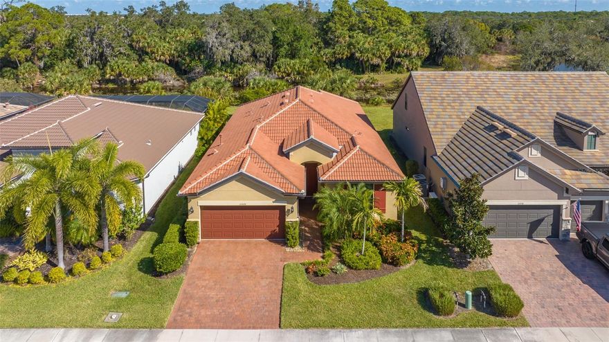 Rarely available expanded Summerwood floor plan overlooking one of the best lots on Palmer Ranch* Private views of South Creek backed by nature preserve with no homes behind you* Enjoy watching Bald Eagles, Ospreys, Sandhill Cranes & more from your covered screened in lanai* This move in ready home features 3 bedrooms plus den/office & 2 full baths* Very open & spacious great room floor plan* Real wood flooring throughout the living area with upgraded carpets in master bedroom & 3rd bedroom* Gourmet kitchen with upgraded white cabinets , quartz counters & Kitchen Aid stainless appliances* Custom glass back splash* Crown moldings & 8 ft. doors throughout* Hurricane impact windows & HIP ROOF for lower insurance costs* No CDD fee* Sandhill Preserve is a maintenance free resort style community with a state of the art clubhouse, activity director, fitness, tennis,  heated pool/spa pickle ball & more* This is a boutique community of just 303 homes located close to shopping, Legacy Trail & minutes to world famous Siesta Key Beaches* Why wait to build when you can own this “like new” home on an incredibly private lot*