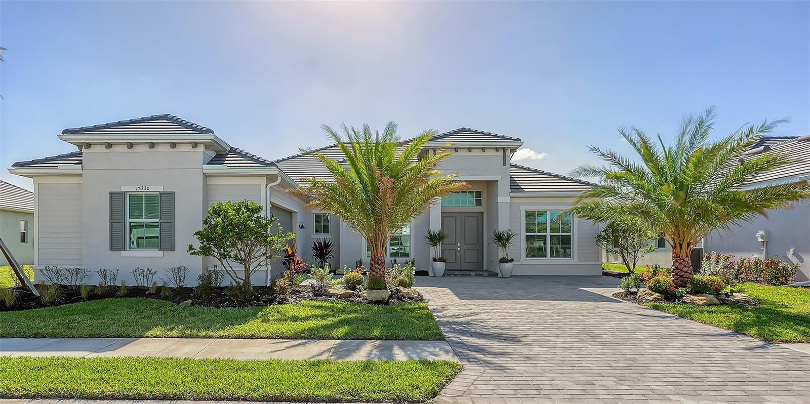 Welcome to Paradise! This gorgeous 3-bedroom 3-bathroom (plus Den) turnkey furnished single family home is located within the gated golf Community of Wellen Park Golf & Country Club. This Bougainvilla II Estate home offers 3,917 sq. ft total (including lanai, garage etc.) a clever open floor plan featuring well thought out living space and delivers an open airy feel designed for Florida resort style living and entertaining. Upgraded lighting, accent walls, built in kitchen and bar and sound system on the lanai with private heated pool and spa are just a few of the upgrades offered throughout with ceiling fans in all bedrooms. The large open kitchen is at the heart of this home and is every cook’s dream with large kitchen island, stainless steel appliances and ample storage. This split-plan offers privacy for owner and guests alike. The Master suite is on one end of the home and offers two walk-in closets, a gorgeous en-suite bath with dual sinks, large walk-in shower and private entry to the lanai. At the other side of the home, an additional master guest bedroom offers its own en-suite bath with access directly to the pool, the third bedroom is just off the kitchen with another full bath nearby across from the laundry room. This home is complete with a home office for those who work from home. This property also offers a street legal golf cart which can be rented for an additional fee! The Bougainvillea II has plenty of room for the whole family. Hurricane impact resistant windows and doors are featured. Take your love of the game to the next level on the newest Gordon Lewis championship golf course. This home is being offered with option to purchase golf membership as well as access to resort style amenities such as main resort style pool, 3 satellite pools, fitness center, tiki bar, pickle ball, tennis courts, bocce ball and more! $65.00 monthly food & Bev. min required at the on-site Tiki Bar. This community is located in close proximity to the Cool Today Atlanta Braves Training Stadium and Downtown Wellen Park which offers an array of shops, live music, events, restaurants, lake, walking trails, kayak and paddle board rentals, farmers market, and more. Only a short distance to our beautiful Gulf beaches. Call for a showing today!