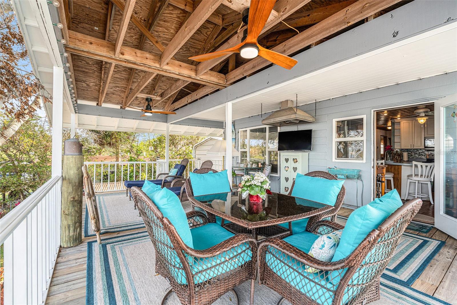 Do you have lots of outdoor toys? Do you need lots of parking spaces? You can actually park 6 cars in the garage here! Make your showing appointment today! Discover your riverside sanctuary with this exquisite riverfront house and serene outdoor living space ideally located in the heart of Hillsborough county. Here, natural beauty meets charm. Nestled among mature trees and nature, this home offers direct water access ideal for kayaking, canoeing, and fishing. The upper level includes a beautifully appointed kitchen as well as a charming wooden deck—ideal for relaxing or entertaining. The second floor provides two bedrooms and a bathroom. A second bathroom can be added to this property pretty easily. Living room, kitchen and bar area ensures ample space for family and friends. Outside, a concrete patio extends your living space, featuring a dedicated BBQ area with a mini bar and tiki hut—perfect for enjoying the peaceful surroundings on cooler evenings. There’s plenty of space to bring all your toys—whether it’s an RV, boat, or other recreational equipment. . Plus, there are no HOA or CDD fees to worry about. Embrace the perfect blend of tranquility and garage space for the man of the house. Make this charming riverfront retreat your favorite place!