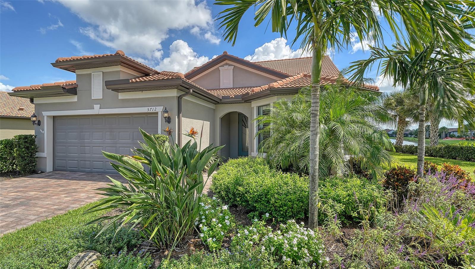 Prepare to be wowed by the long expansive lake views from this expanded & customized Summerwood floor plan* Featuring nearly 3100 sq. ft. architectural elegance* One of the best lake lots in Hammock Preserve with no house on the right & endless water views in back* The downstairs features 3 generous bedrooms plus office/flex room & 2 baths* Upstairs is a perfect guest area with large 26x20 bonus room, custom built-ins, large bedroom & full bath* The main living area boasts of beautiful wood look tiles* Gourmet kitchen with white soft close cabinets, quartz counters, top oof the line Kitchen Aide appliances* Screened in lanai area with picture frame screening to capture the amazing view* Heated pool with aqua chairs, real Travertine marble lanai flooring* Free standing jacuzzi for your enjoyment* The garage has a four ft. extension of the depth to allow for additional storage* The current owners have done numerous upgrades & special features to please the most discriminating buyers* Hammock Preserve is a maintenance free resort style community* Fee includes landscaping, irrigation system maintenance & water, access to the state of the art clubhouse featuring an Olympic size heated pool, fitness center, firepit, tennis, bocci, pickleball & more* Located in popular Palmer Ranch near Legacy Bike Trail, shopping & minutes to world famous Siesta Key Beaches*