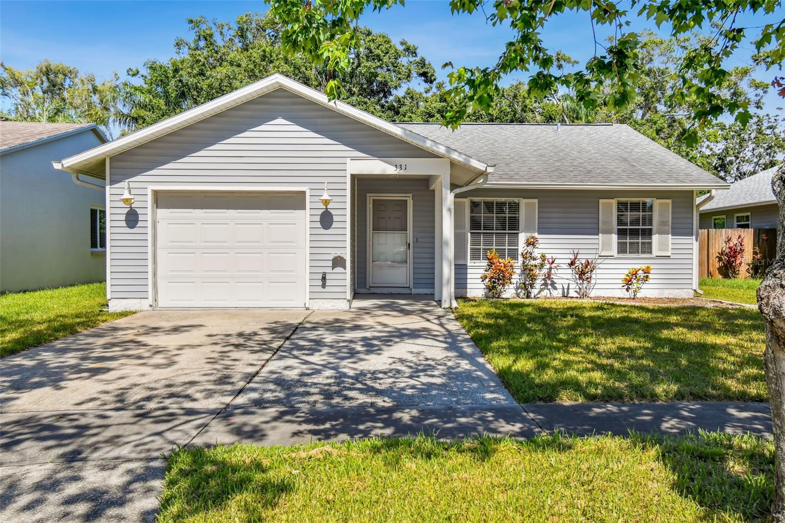 Welcome to this adorable 3-bedroom, 2-bath home in the heart of Clearwater! Built in 1991 and offering over 1,100 square feet of comfortable living space, this home is move-in ready and full of charm. You’ll love the seamless vinyl flooring throughout and the modern kitchen featuring stainless steel appliances. The open layout is functional and spacious. Step outside to a large, fully fenced backyard with a paver patio—ideal for weekend BBQs or enjoying the Florida sunshine. Additional highlights include a one-car garage and a washer and dryer for your convenience. Located just minutes from world-famous beaches, shopping, dining, and more, this home offers the perfect blend of comfort and convenience. Don’t miss your chance to experience Clearwater living in this perfect single family home.