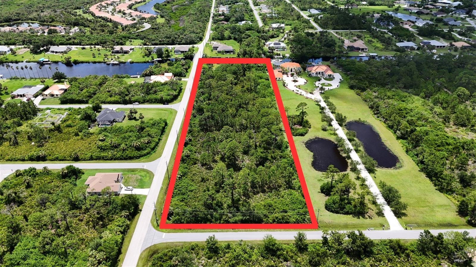 Welcome to 1509 SW McHugh Street, a rare opportunity to own over 2.5 acres of buildable land in the heart of Port Charlotte. This expansive parcel offers incredible versatility — ideal for developers looking to subdivide or for a homeowner seeking to build a custom estate with room to spread out. With plenty of space for a main home, guest houses, a pool, and recreational areas, the possibilities are endless. Located in a peaceful residential area with no HOA and no deed restrictions, you’ll enjoy the freedom to design without limitations. The property is just minutes from shopping, dining, and local schools, with easy access to major highways and the Gulf beaches. Whether you’re investing for the future or ready to build now, this lot is a solid choice in a fast-growing area of Southwest Florida.