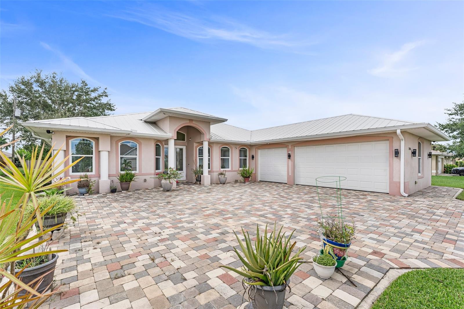 For Lease – Executive Home in SE Cape Coral!!! If you’ve been searching for a rental that truly feels like a home, this stunning property in Cape Coral is the one. Nestled in a quiet, well-kept neighborhood, it offers the perfect blend of comfort, style, and convenience—ideal for professionals, families, or anyone looking to enjoy Florida living at its finest. Step inside to an airy, open layout with soaring 9-foot ceilings and plenty of natural light. The heart of the home is the gourmet kitchen, which features 42-inch real wood cabinets, granite countertops, stainless steel appliances, and a spacious walk-in pantry. It flows seamlessly into the great room, which is perfect for entertaining and comes pre-wired with a ceiling speaker sound system. Large sliding glass doors lead to a fully enclosed, air-conditioned lanai—ideal for enjoying sunny Florida days in comfort. The primary suite is a private retreat, featuring dual walk-in closets with real wood cabinetry and a spa-inspired bathroom complete with double vanities, a soaking tub, and a separate walk-in shower. There’s also a sound system in the bedroom for a touch of luxury. Two additional bedrooms each come with their own full bathroom, providing space and privacy for guests or family members. A spacious flex room with a half bath—previously used as a home office—offers flexibility for remote work, a study, media room, or even a fourth bedroom. The dedicated laundry room includes extra storage space and a utility sink for added convenience. Outside, enjoy a meticulously landscaped yard with lush greenery, a three-car garage, and an online-accessible security camera system for peace of mind. The home is pet-friendly (with approval) and located just minutes from Coralwood Shopping Center, Four Mile Cove Ecological Preserve, and a wide variety of local restaurants and amenities. This is more than just a rental—it's a home designed for comfort, function, and enjoyment. Schedule your private showing today and experience elevated living in Cape Coral.