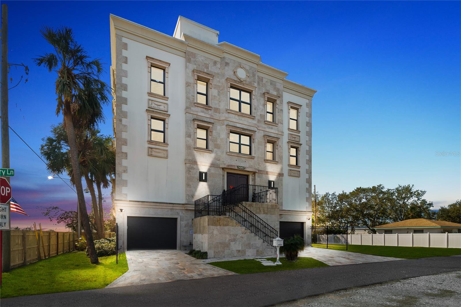 Under contract-accepting backup offers. Welcome to the RaceCar Mansion—Your Luxury Fortress Awaits! Price is changed due to recent improvements and inclusions.
Perched 33+ feet above sea level, this extraordinary estate stands entirely out of flood zones, potential hurricane resilience and possible insurance benefits due to elevation and construction (buyer to verify).
Priced at an incredible $/ sqft for air-conditioned space (when EXTRA lot deducted)— likely below current building costs—this is a once-in-a-lifetime opportunity. Factor in the extra vacant lot, the oversized garage, or the stunning rooftop terrace w water views. What a Deal!
The property combines two parcels— 3087 Cherry Ln (the mansion) plus formerly separate vacant lot adjacent —under one tax ID, offering potential value and tax advantages and space for expansion. With room to plant boxwood or other shrubbery around the perimeter, you can create a true fortress-like setting; lot splitting, fencing & adding a pool for a perfect oasis are all subject to zoning, govt regs.
Step inside and experience refined elegance & modern sophistication. The chef’s kitchen is a gourmet dream, equipped with Miele appliances (gas stovetop, oven, dishwasher, coffee maker), plus a Sub-Zero refrigerator and Marvel wine fridge. Turnkey package is available for just $49K includes all furniture, most smallwares, bedding, dishes, decor (except personal art collection and personal items), 32+smart TVs, advanced AV tech, specialized garage tools, appliances and more—so you can move in with just a toothbrush and start living your dream tomorrow!
Seller invested significantly both time & money into restoring this beautiful mansion and making it better, stronger, safer over the last 3 years including significant HVAC restoration; replacements of fencing, new front doors, many roof repairs, appliances, plumbing, elevator upgrades & restorations.
For automotive enthusiasts, the garage is spectacular—accommodating up to six cars with direct first-floor access and extra flexible space. 3 phase power is a must have for certain tools, elevator, complex commercial HVAC high efficiency Japanese Daikin unit Third level features four sumptuous bedroom suites each feature walk-in closets and en-suite baths, creating private retreats. The fourth floor’s open-concept design seamlessly connects living, dining, and entertaining areas, surrounded with virtual reality tv walls.
A crown jewel of this residence is the rooftop terrace, offering panoramic views of Tampa Bay and the Bayside Bridge. Feel like the king or queen of your fortress as you overlook the azure waters from this remarkable vantage point—perfect for hosting sophisticated gatherings, unwinding under the stars, or adding a pool or hot tub (structural integrity confirmed).
Located steps from Calvary Christian Academy and close Tampa, St. Petersburg, and Clearwater Beach—with Bay Beach a quick drive away for jet skiing—this property offers unmatched convenience.
Seller financing is available for up to $930,000 in first position at below-prime rates (terms apply).
Welcome home to a lifestyle of comfort, security, and refined living. No info is guaranteed accurate. Buyer to verify all data, incl square footage, construction quality, future and present use, area factors among all other components that are important to Buyer. Calculations based on external dimensions thus actual useable sqft can be less. Heated space includes a storage level. Property sold As-Is.